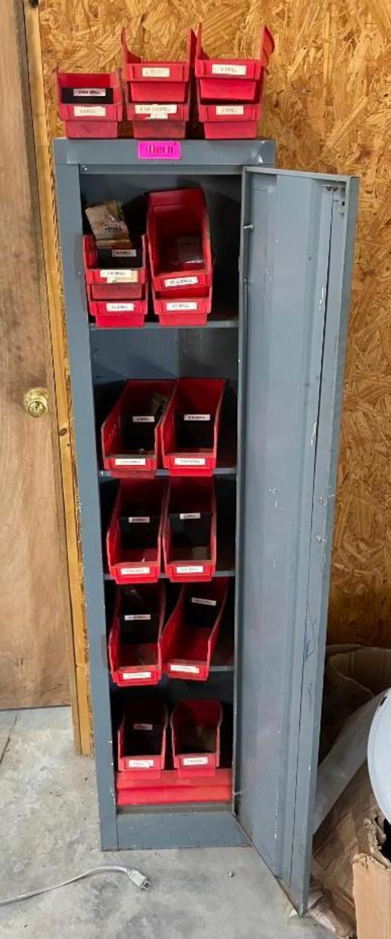 DESCRIPTION: 1-DOOR CABINET WITH ASSORTED DRILL BITS INFORMATION: SEE PHOTOS FOR CONTENTS QTY: 1
