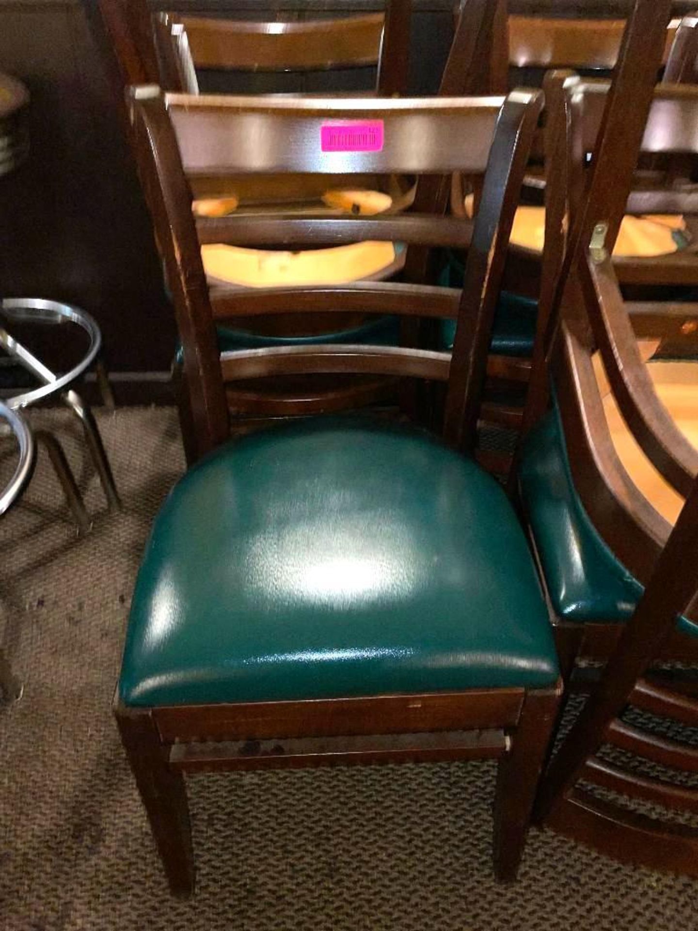 DESCRIPTION: (24) LADDER BACK WOODEN CHAIRS W/ GREEN VINYL SEAT CUSHIONS LOCATION: SEATING THIS LOT