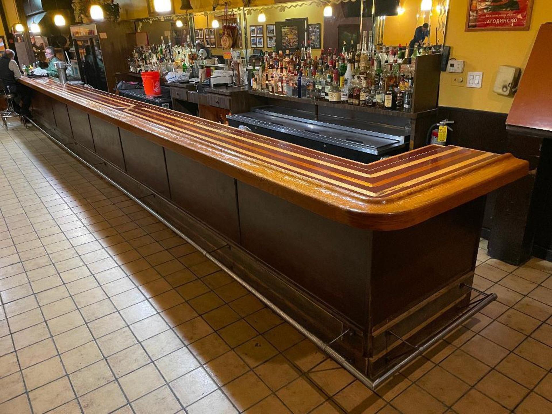 DESCRIPTION: 36' X 24" L SHAPED HARDWOOD BAR TOP W/ FOOT RAIL. ADDITIONAL INFORMATION TAP HEADS ARE