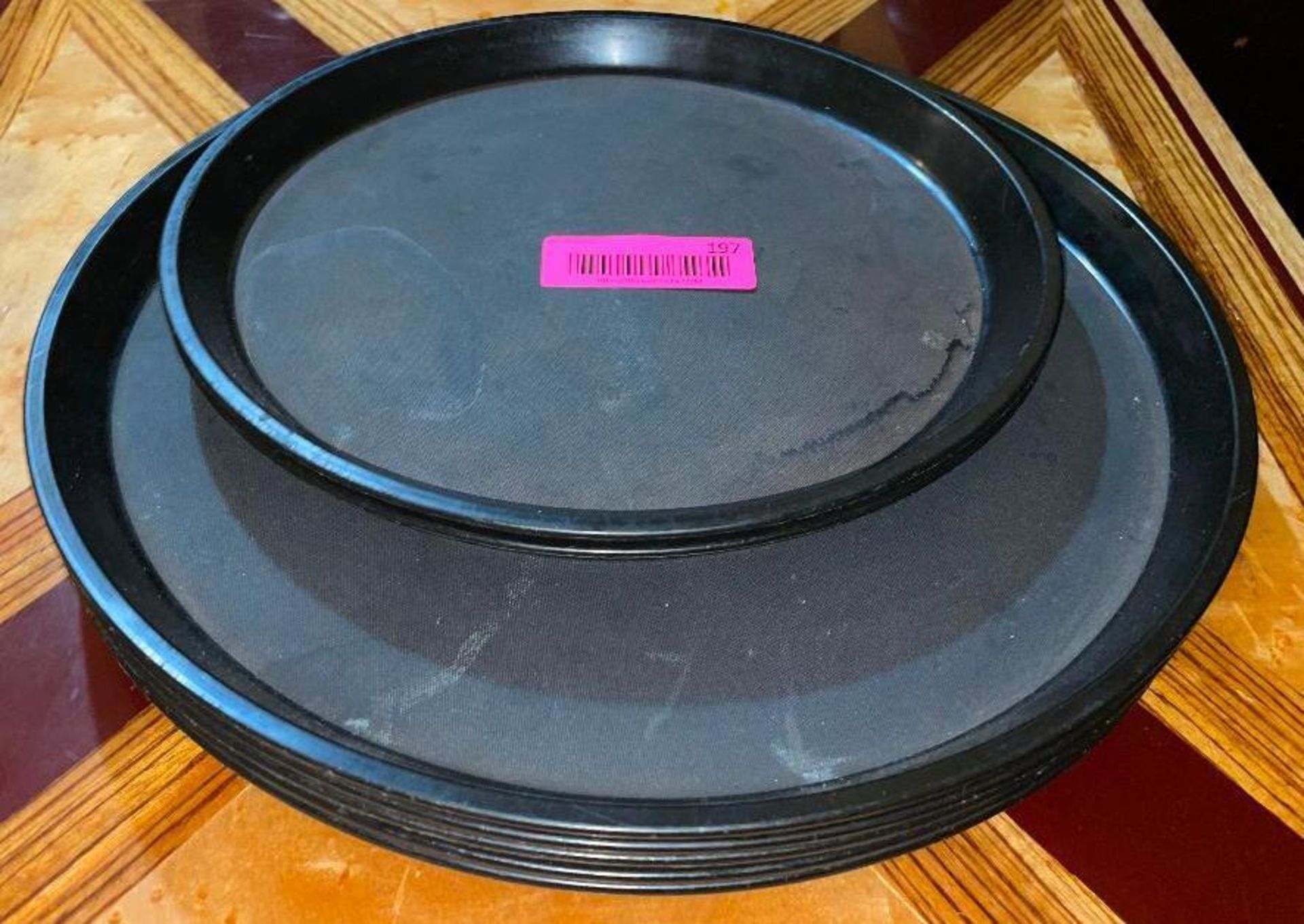 DESCRIPTION: (6) ASSORTED 15" AND 12" BLACK SERVING TRAYS LOCATION: SEATING THIS LOT IS: SOLD BY THE