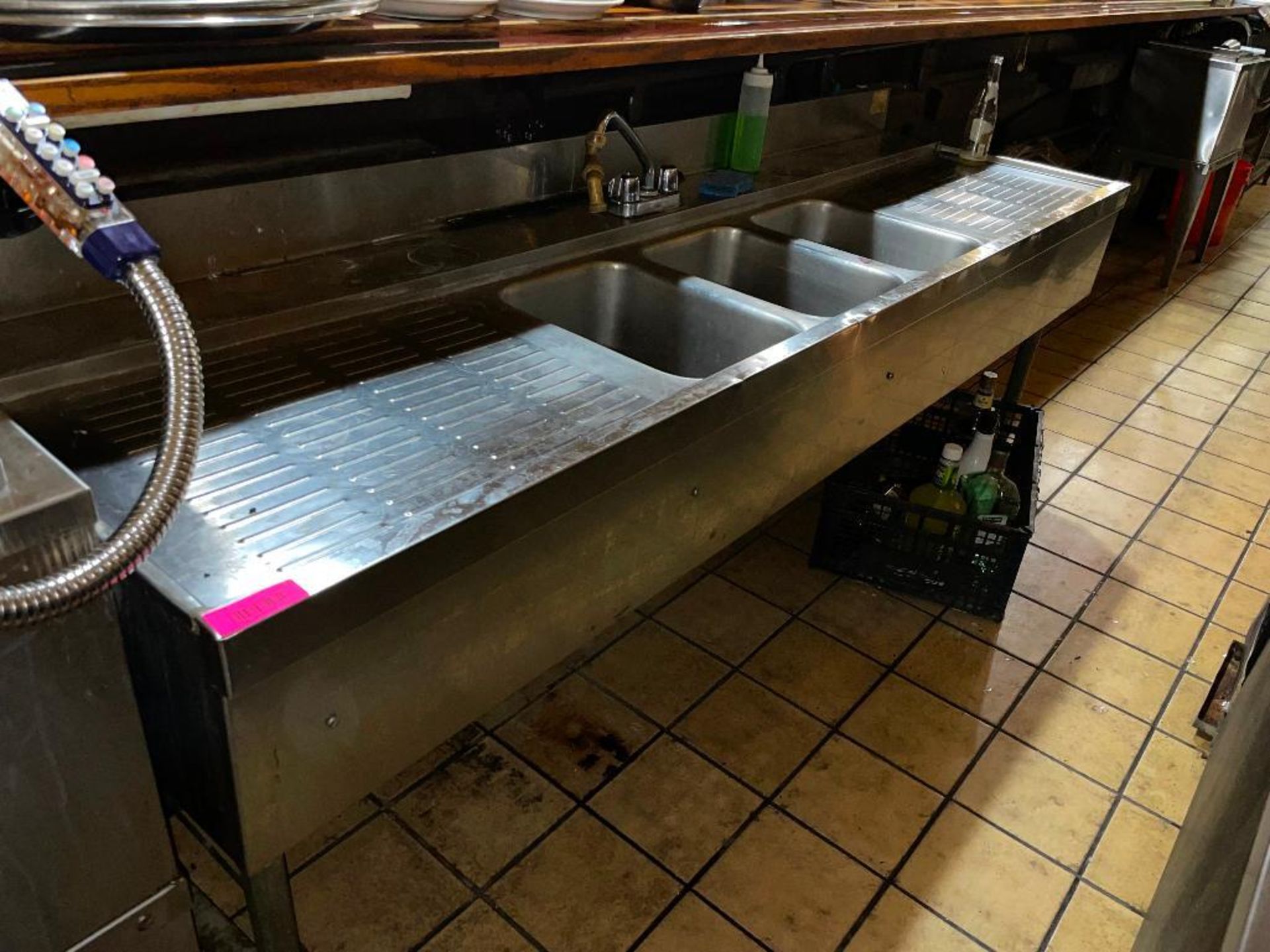 DESCRIPTION: 7' THREE WELL STAINLESS BAR SINK W/ LEFT AND RIGHT DRY BOARDS. ADDITIONAL INFORMATION S
