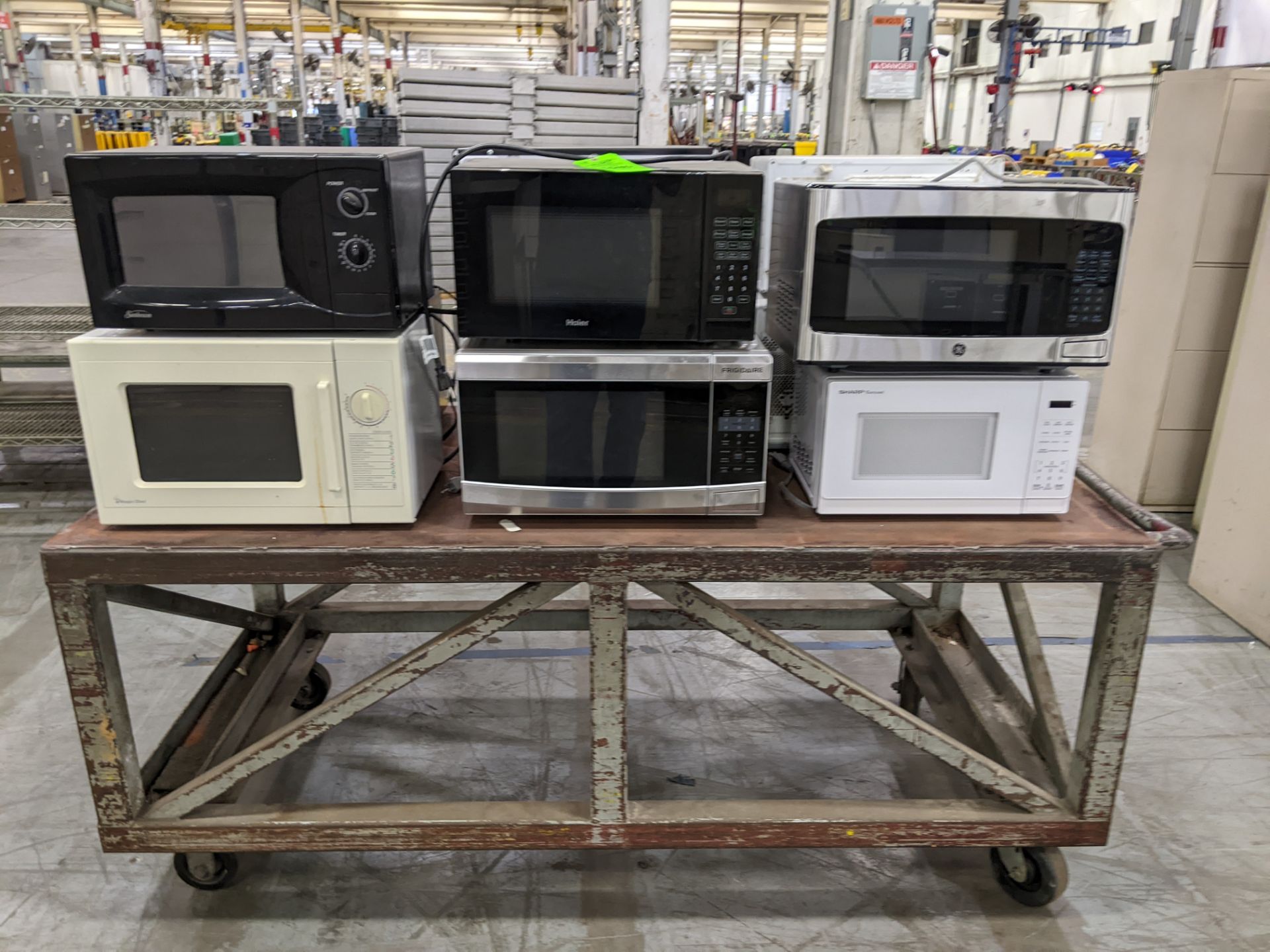 CART WITH (11) MICROWAVES