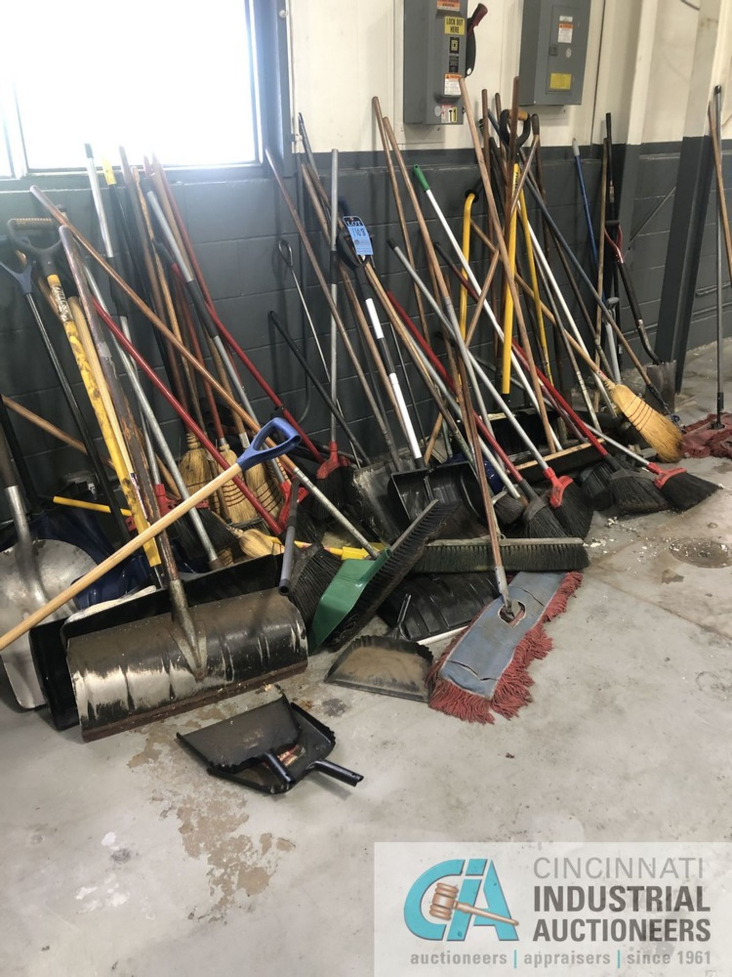 LARGE QUANTITY OF BROOMS & SHOVELS