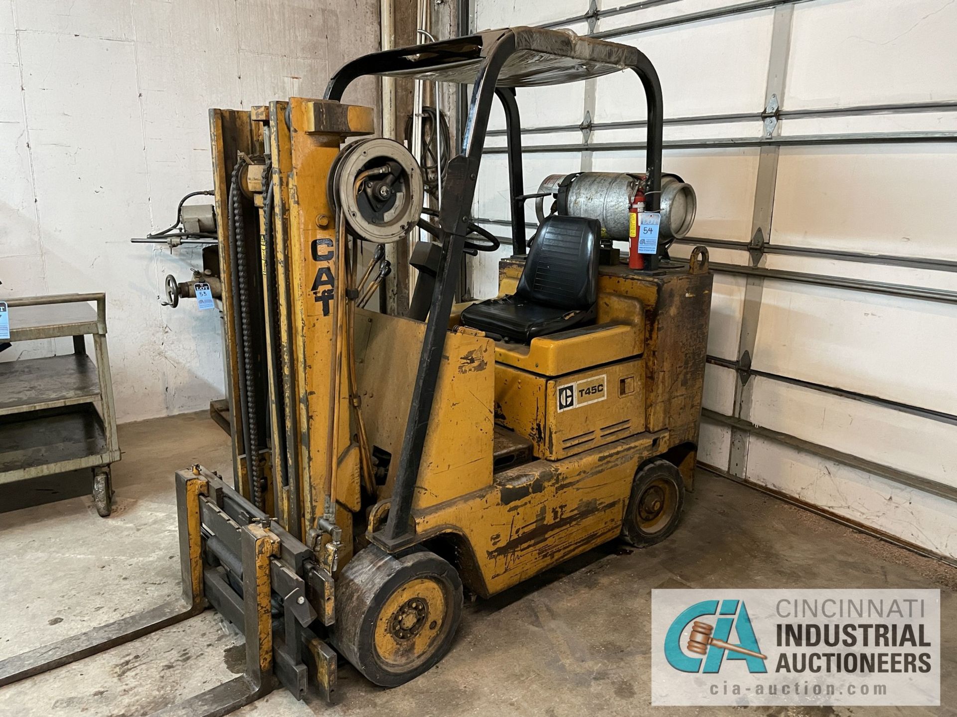 4,500 LB. CAPACITY CATERPILLAR MODEL T45C LP GAS TWO-STAGE SOLID TIRE FORKLIFT; S/N 38Y1543P, 64"