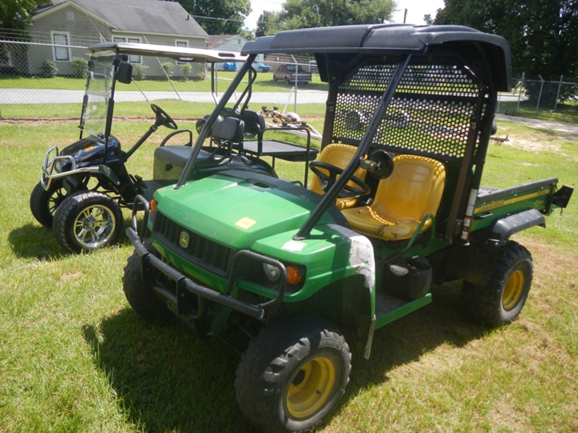 John Deere Gator 4 x4 HPX with dump body. Damage on front fenders 1420 hrs