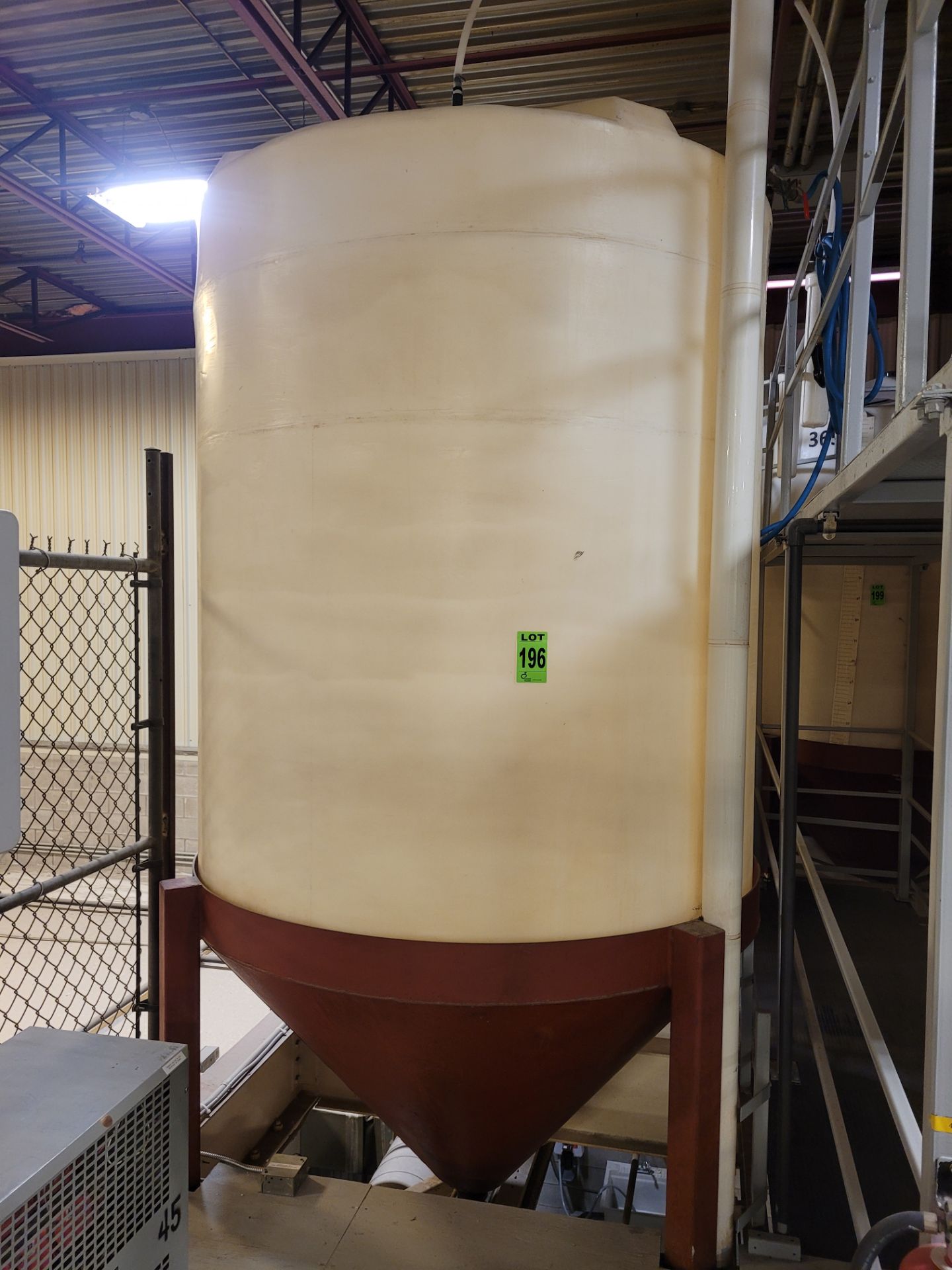 6500 L / 1720 Gal HDPE cone bottom tank on cone bottom steel tank frame, 7' H x 6' D