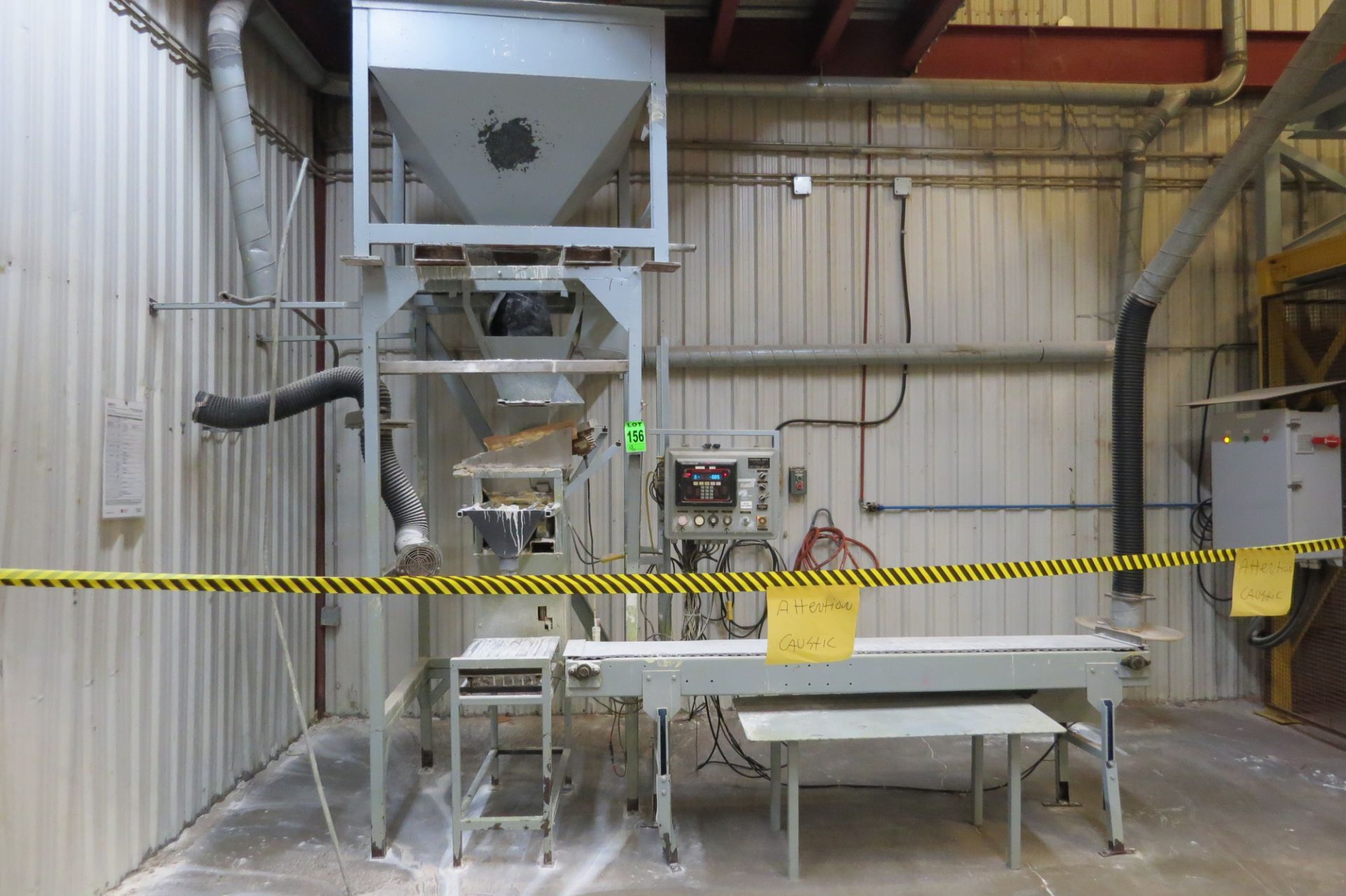 Custom powder filling machine with GMC Controller, hopper, conveyor - formerly used for caustic prod