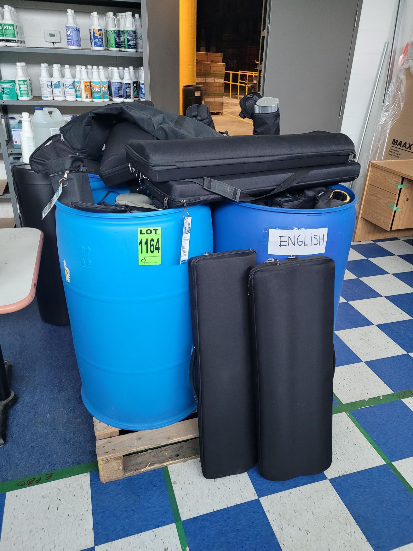 Lot of (4) 55 gal barrels and contents of (25) rolls up signs and promotional displays in cases