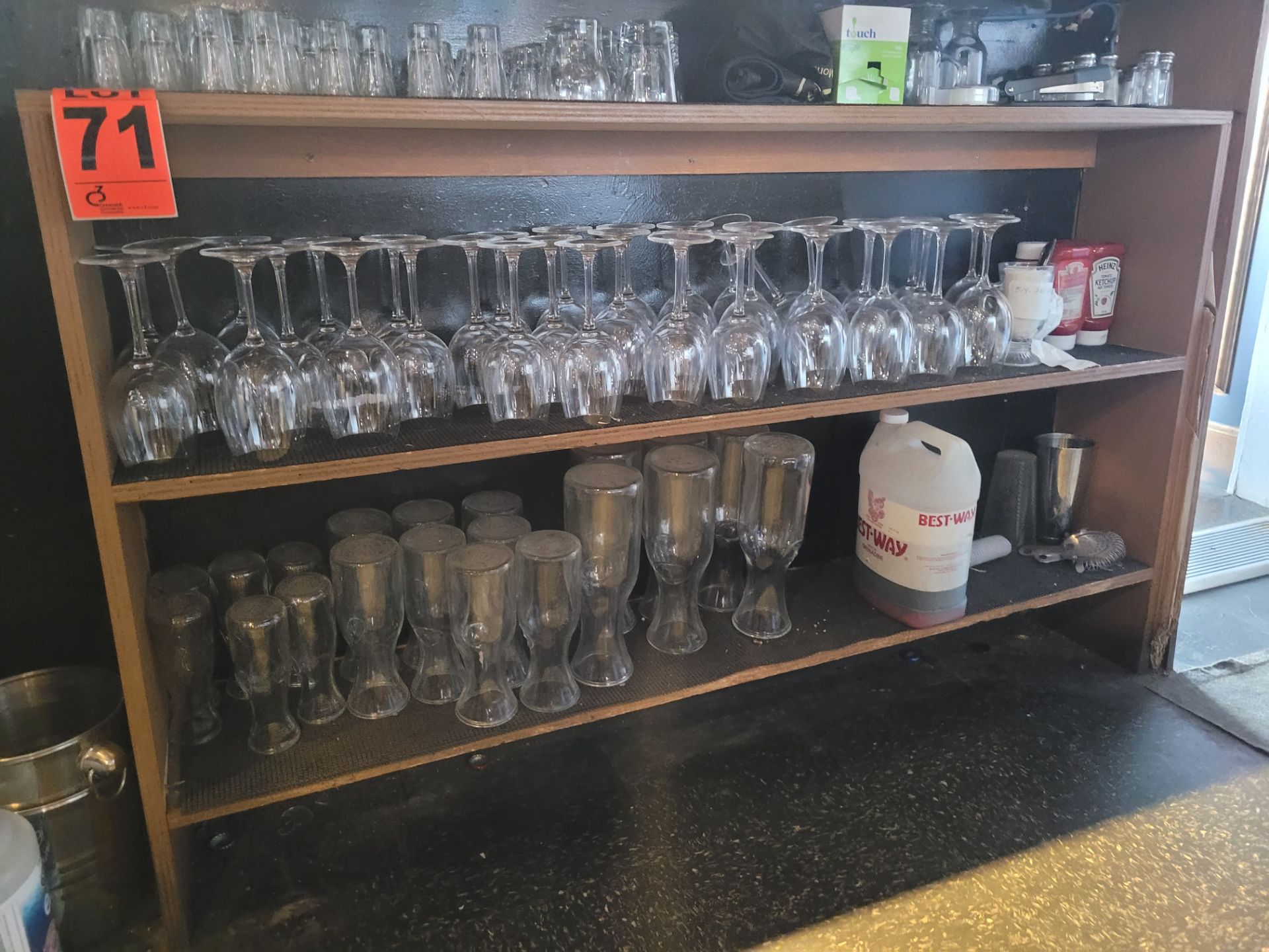 Wooden shelves and (34) wine glasses, (19) carafes, (25) water glasses