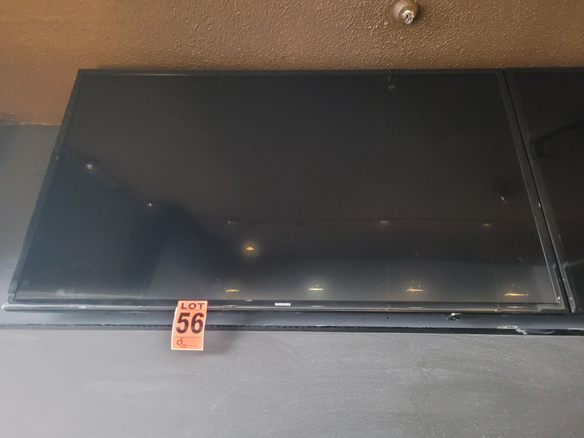 64" flatscreen wall-mount television