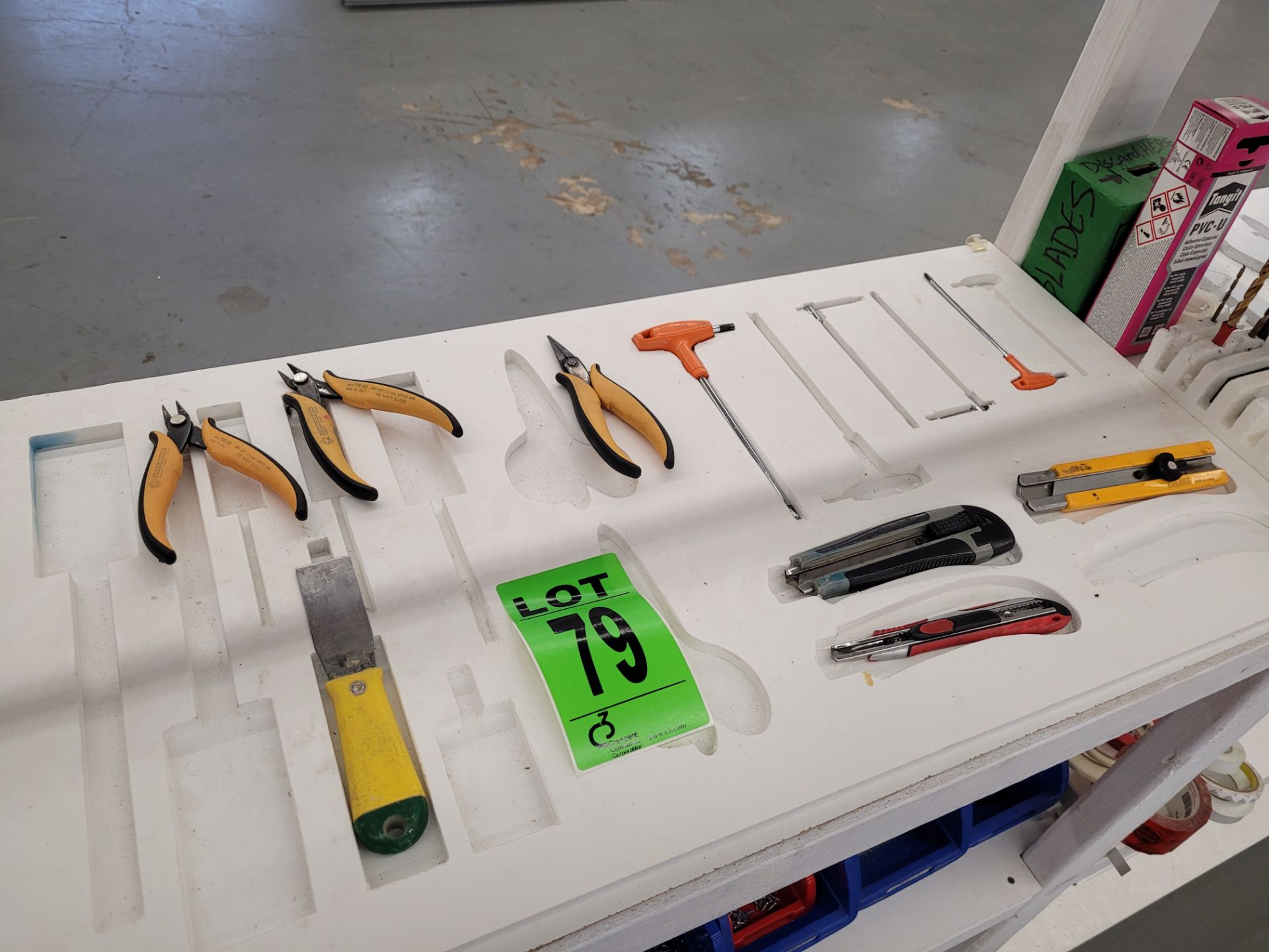 Lot of assorted hand tools including scrapers box cutters, wire cutters, drill bits, blades, tape, (