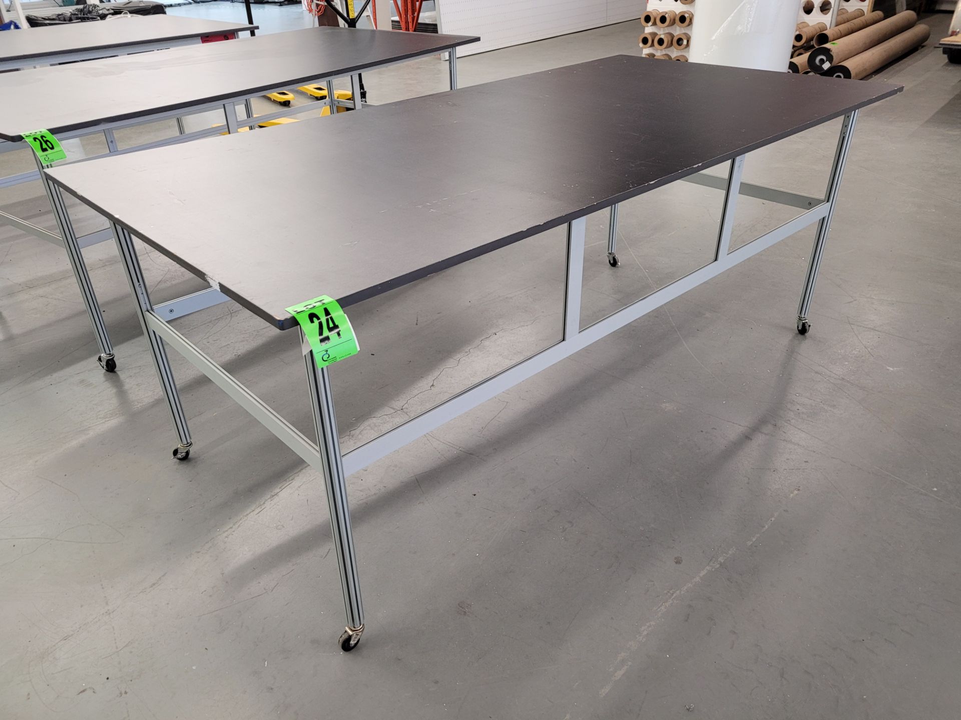 Worktable on aluminum frame, melamine top, on casters, 4' x 8'