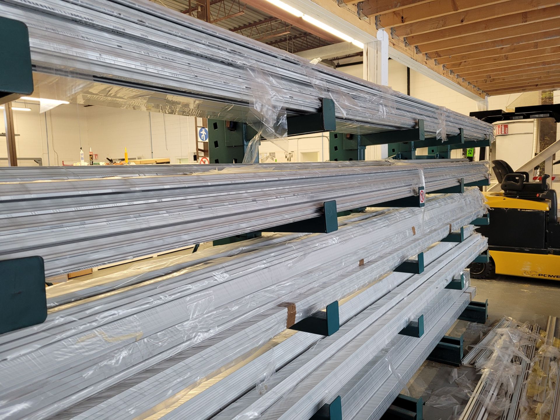 Lot of aluminum extrusions, (18) units total, ~20' L, ~155kg total weight