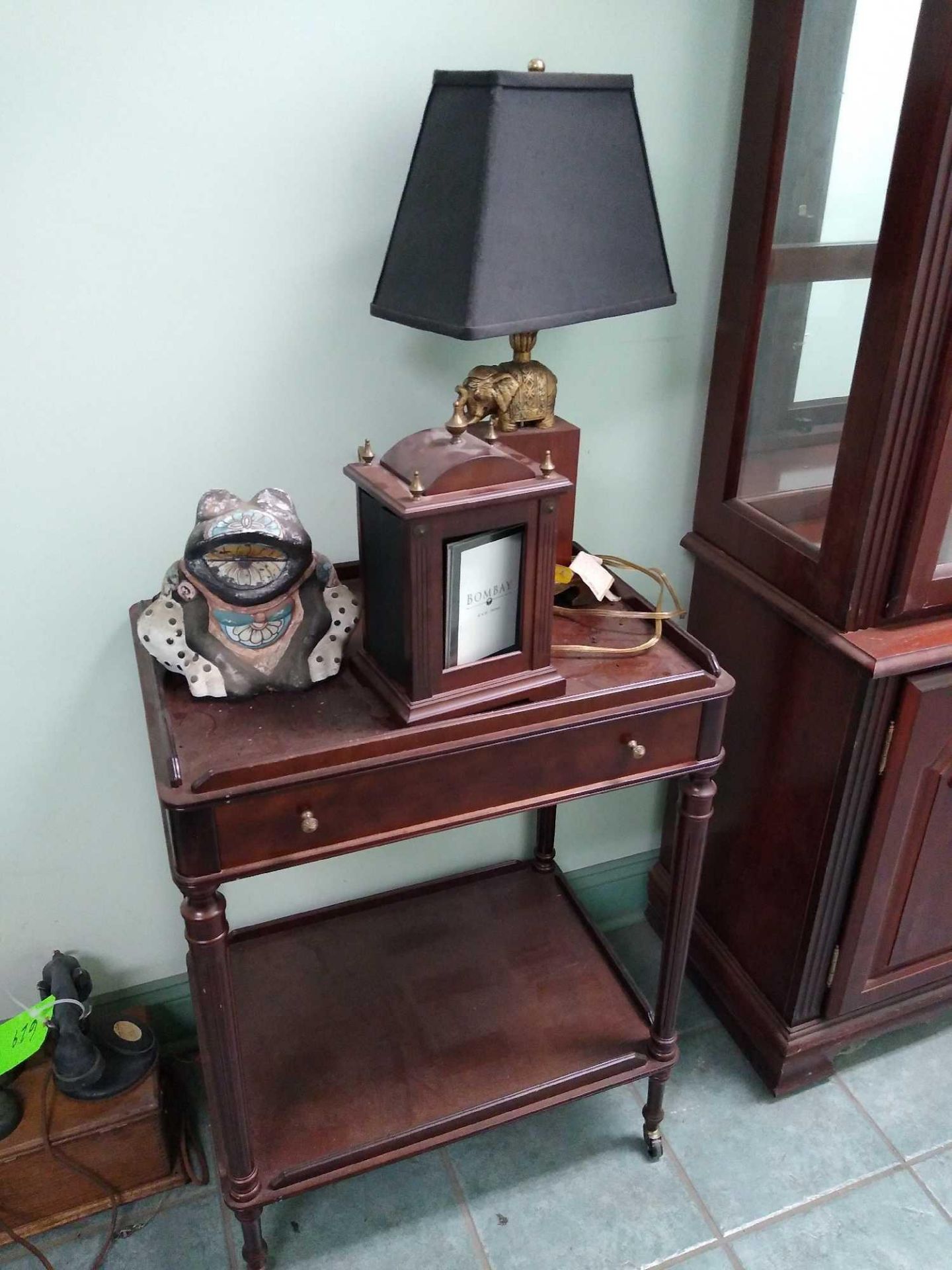 End Table with Decorative Elephant Lamp, Photo Album Display, and Decorative Frog Planter Table Dime