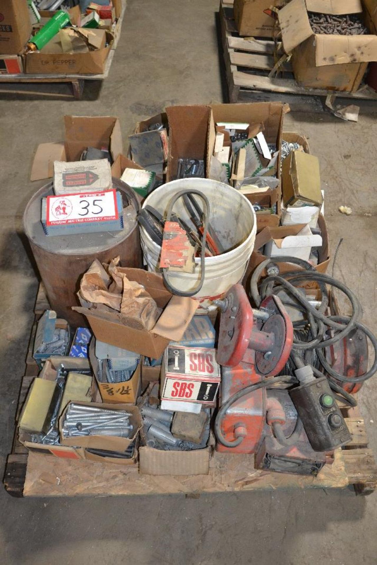 Winch, assorted hardware, nuts, bolts, belts, et., contents of pallet