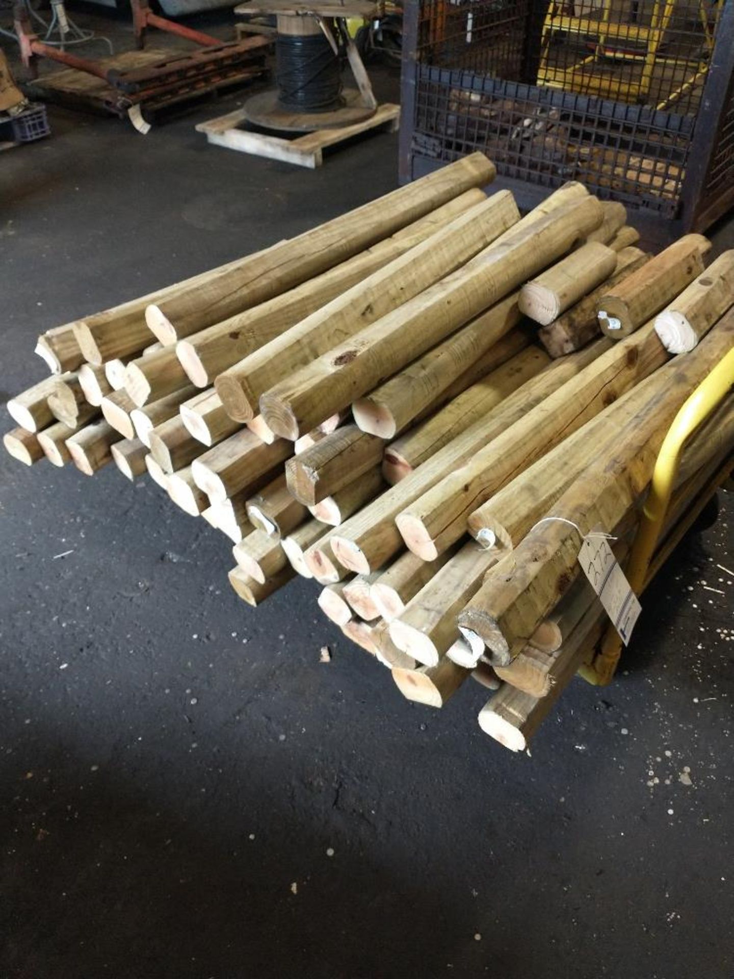 LOT OF APPROXIMATELY 60 TREATED 44" WOOD POSTS