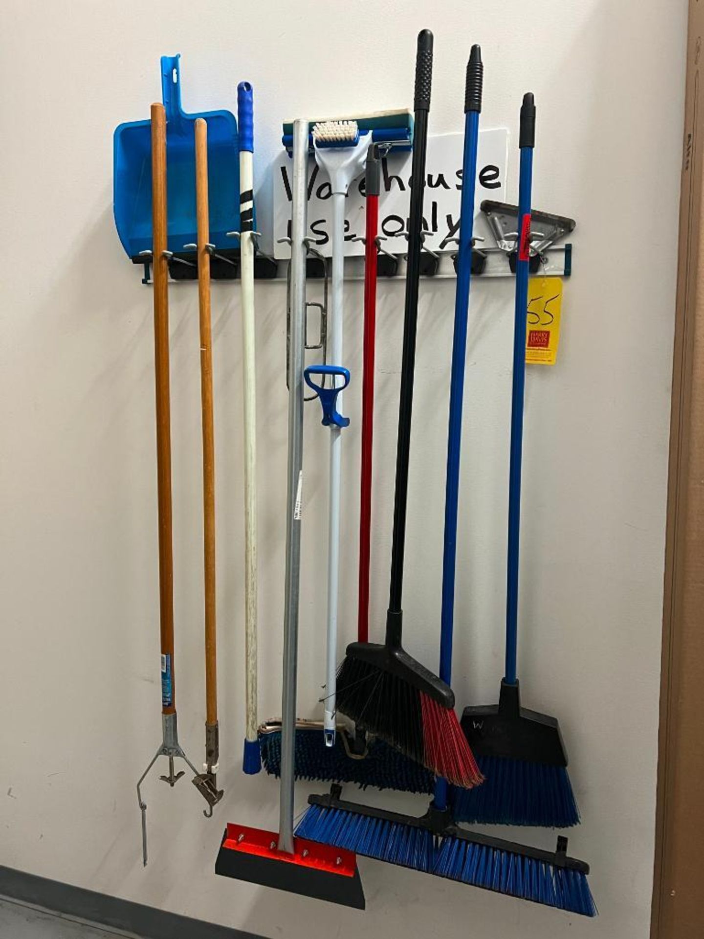 (2) Utility Racks with Assorted Brooms and Mops