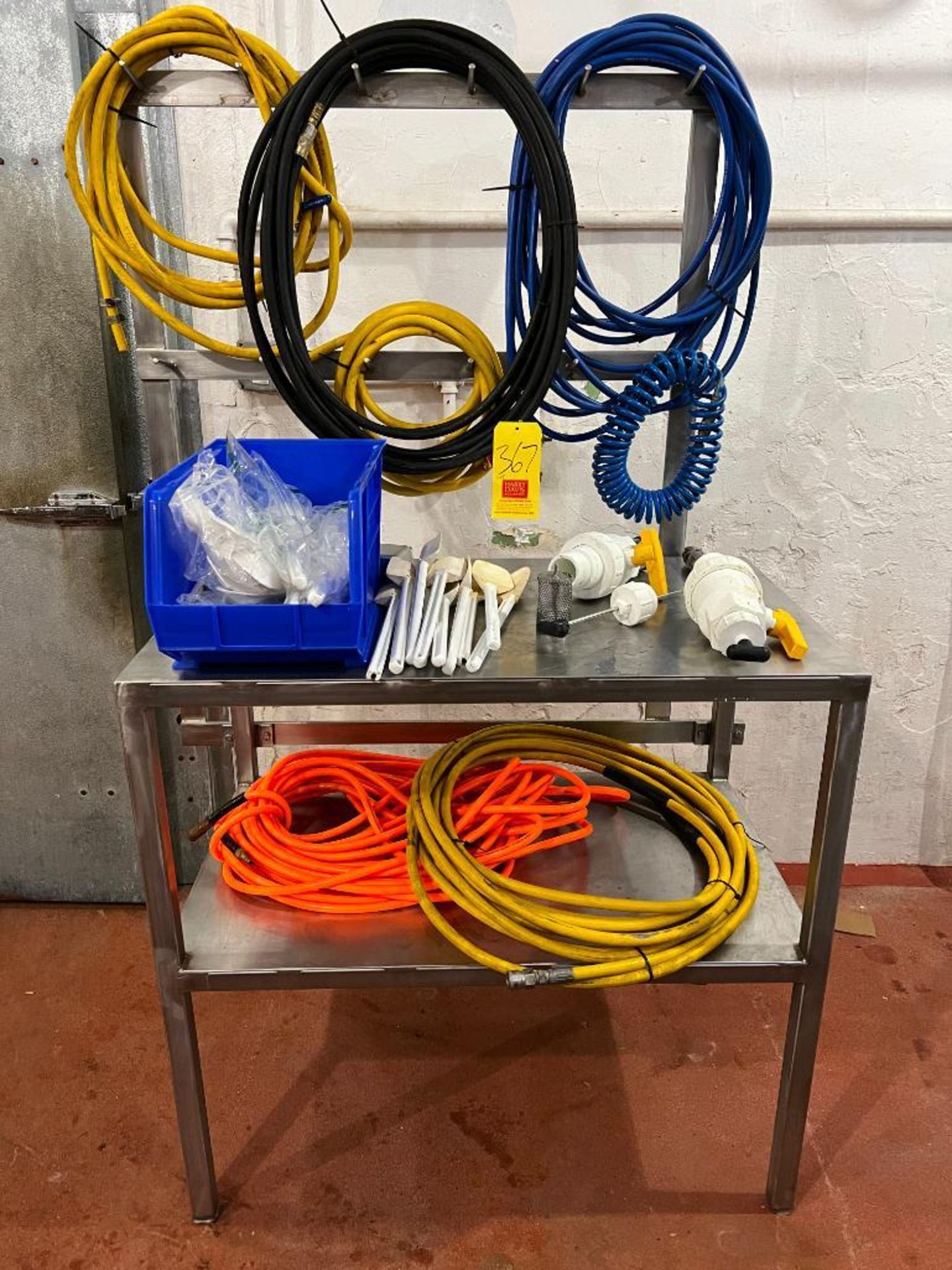 Assorted Hoses, Rubber Spatulas, PVC Tote Valves and S/S Table with Rack - Rigging Fee: $100