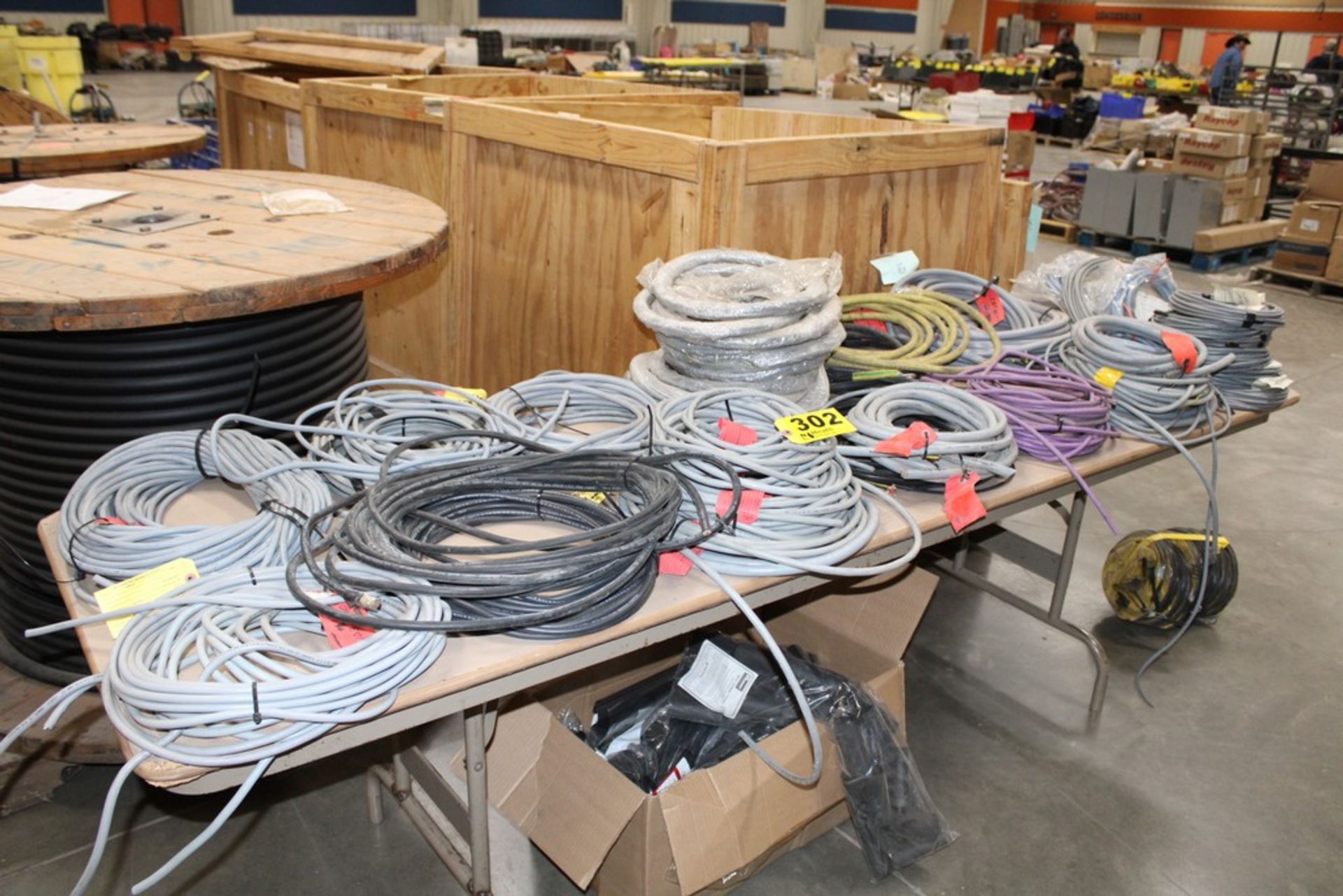 LARGE ASSORTMENT OF WIRE ON TABLE