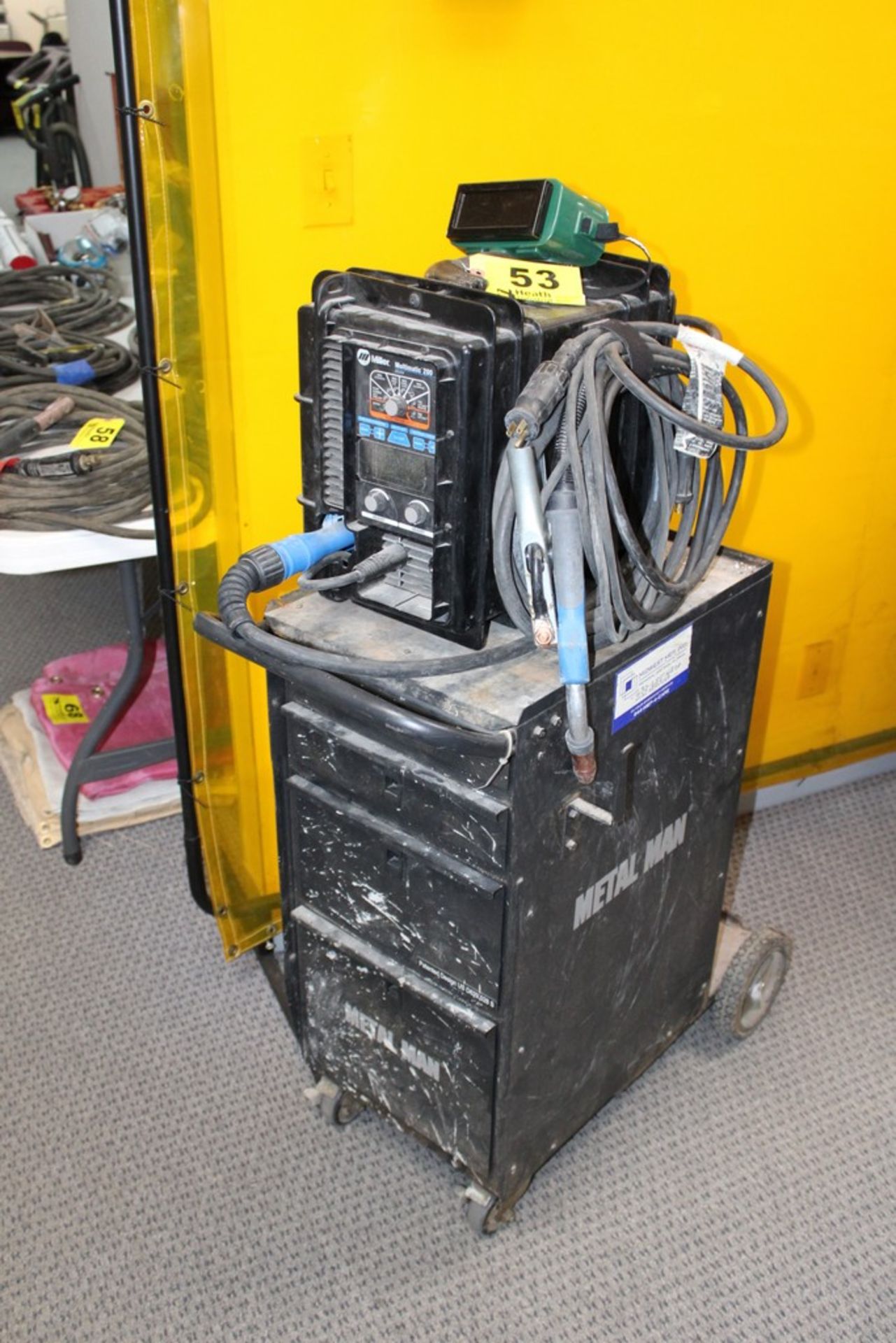 MILLER MODEL MILLERMATIC 200 PORTABLE MIG/TIG WELDER, S/N MH244023N, WITH METAL MAN PORTABLE WELDING