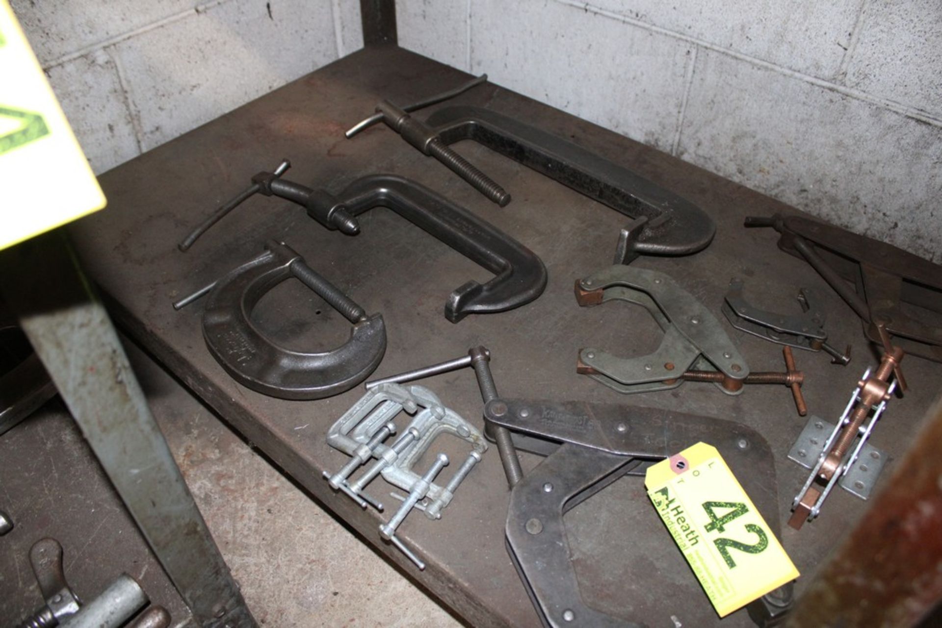 ASSORTED CLAMPS UNDER BENCH