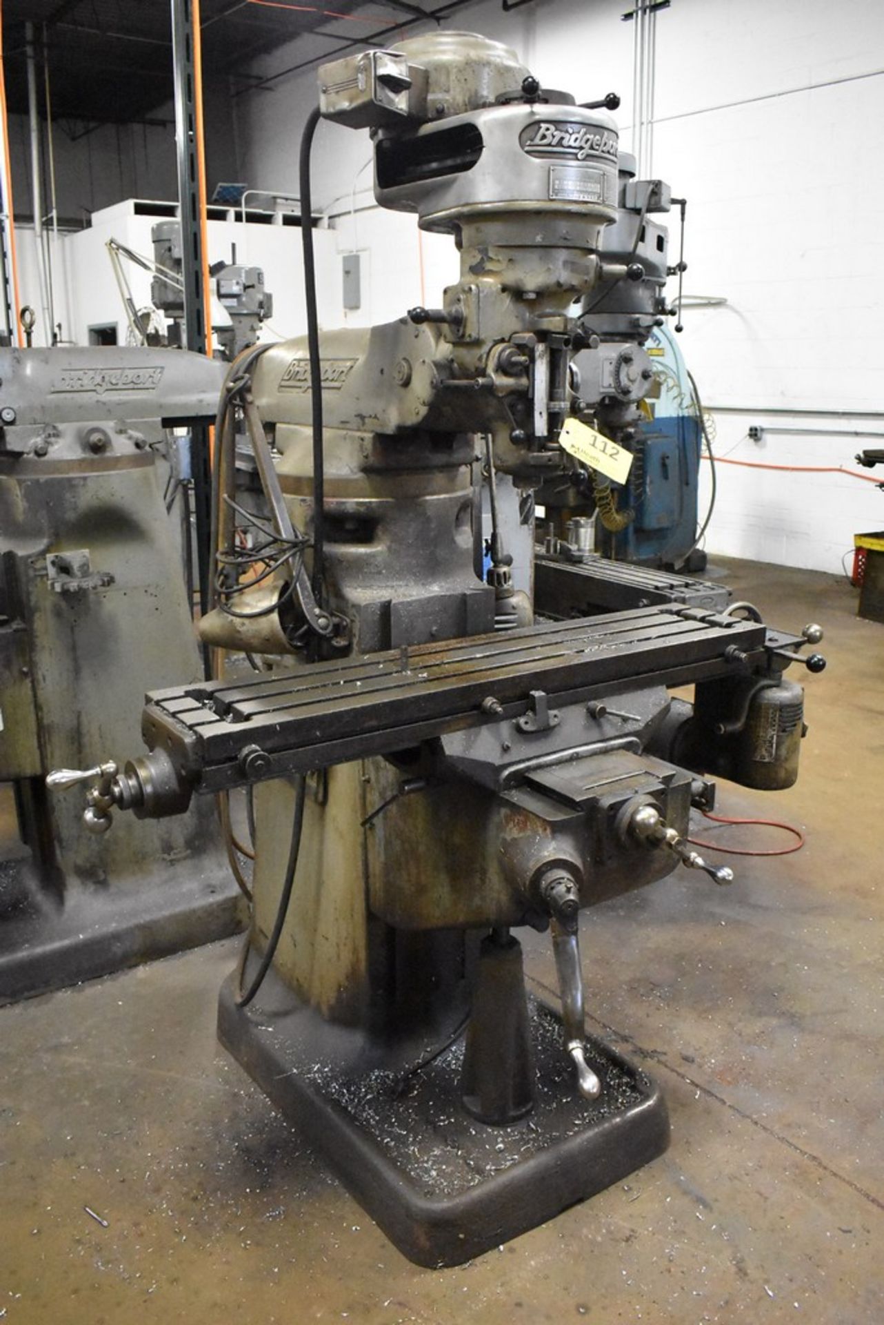 BRIDGEPORT 1 HP "J-HEAD" RAM TYPE VERTICAL MILL, S/N BR35654, 42" POWER FEED TABLE