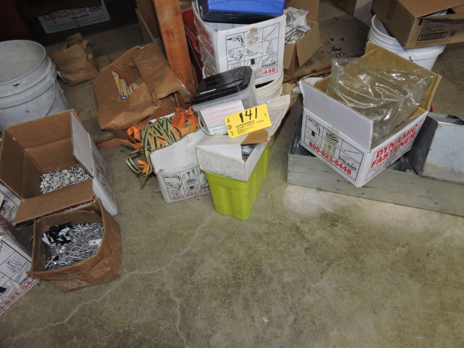 Lot screws and assorted items on floor and in the shelf.