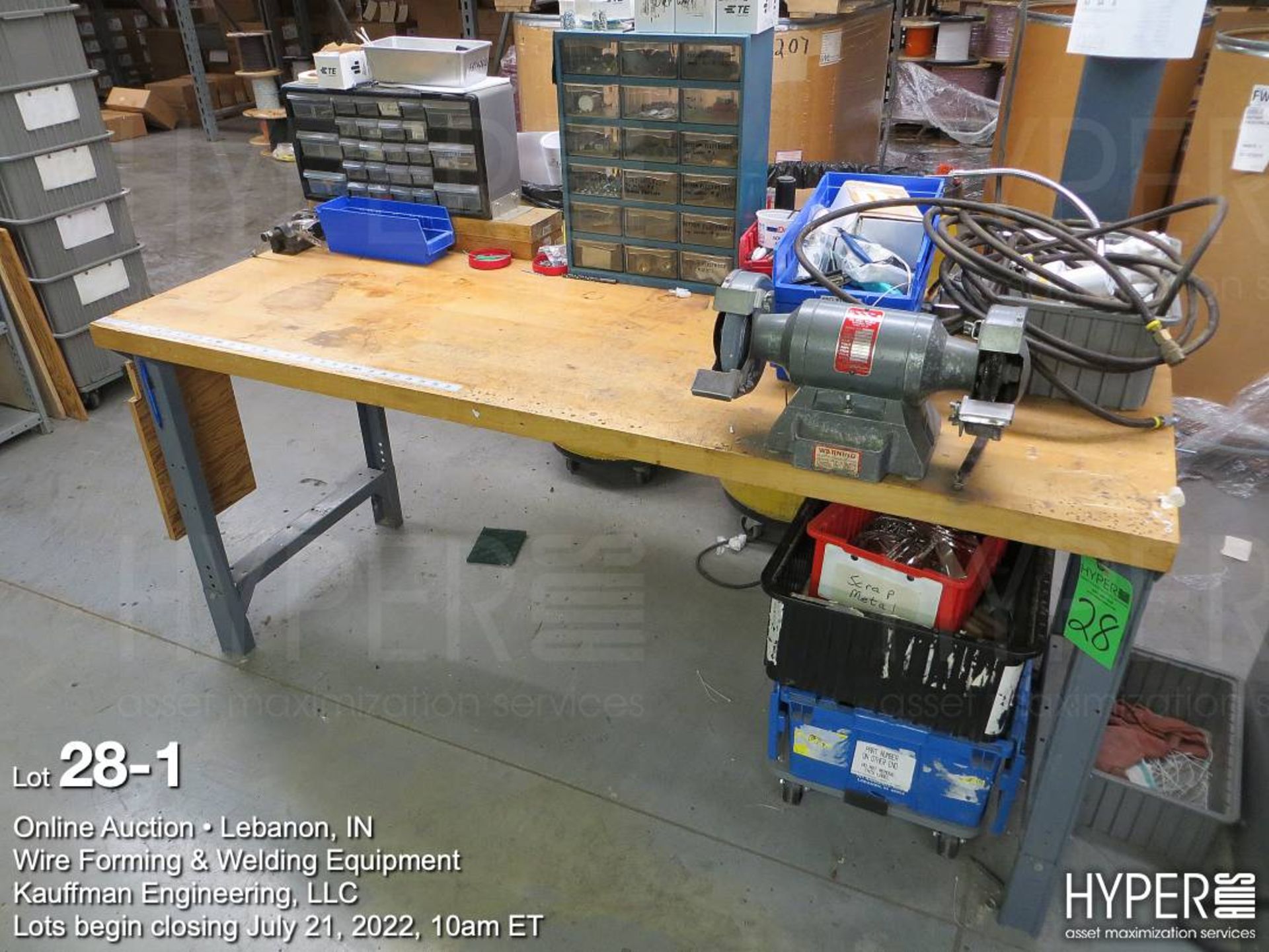 Workbench with grinder, plus contents