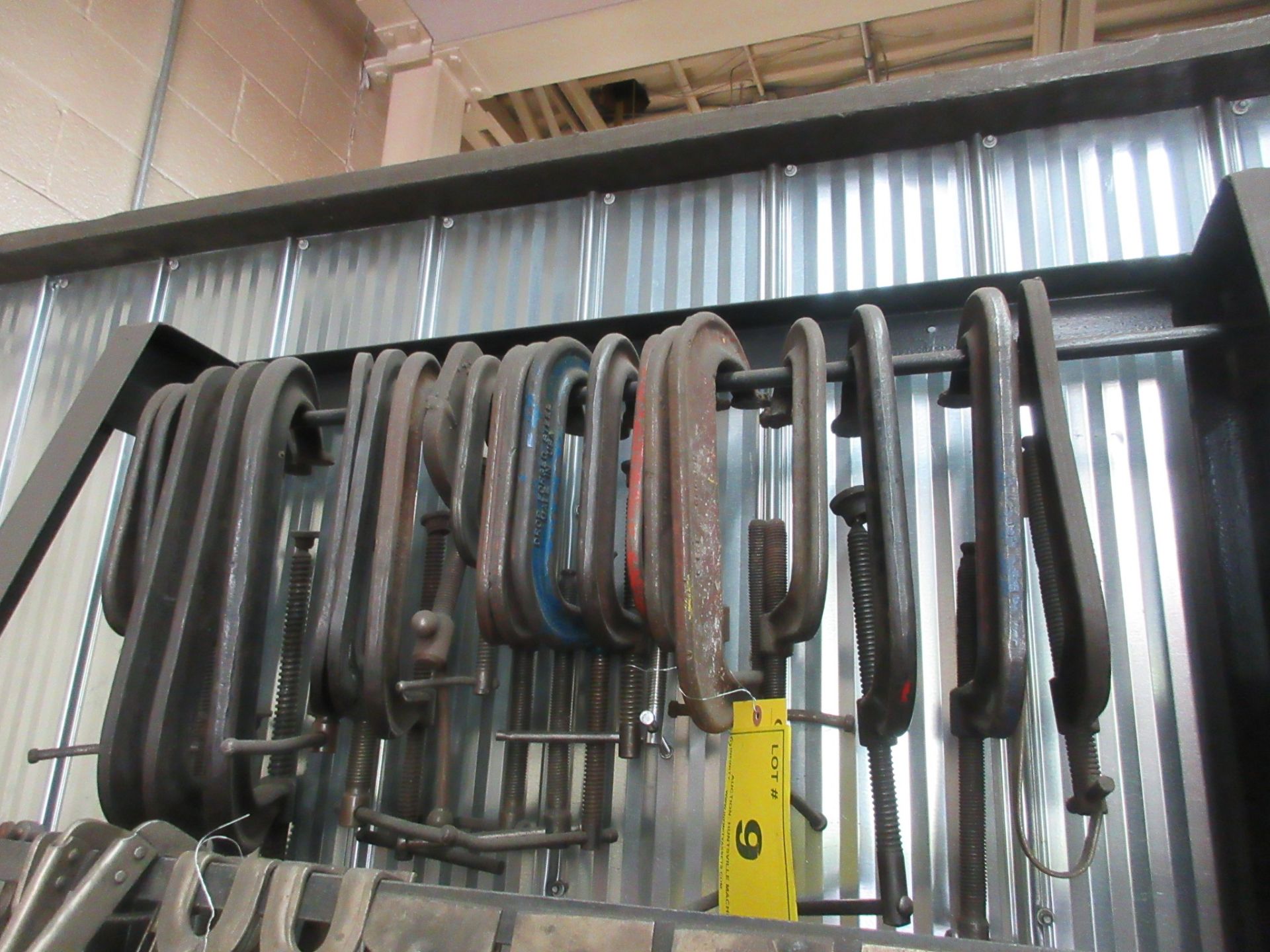 LOT OF APPROX. (21) LARGE C-CLAMPS HANGING FROM TOP ROW OF RACK (NO RACK)