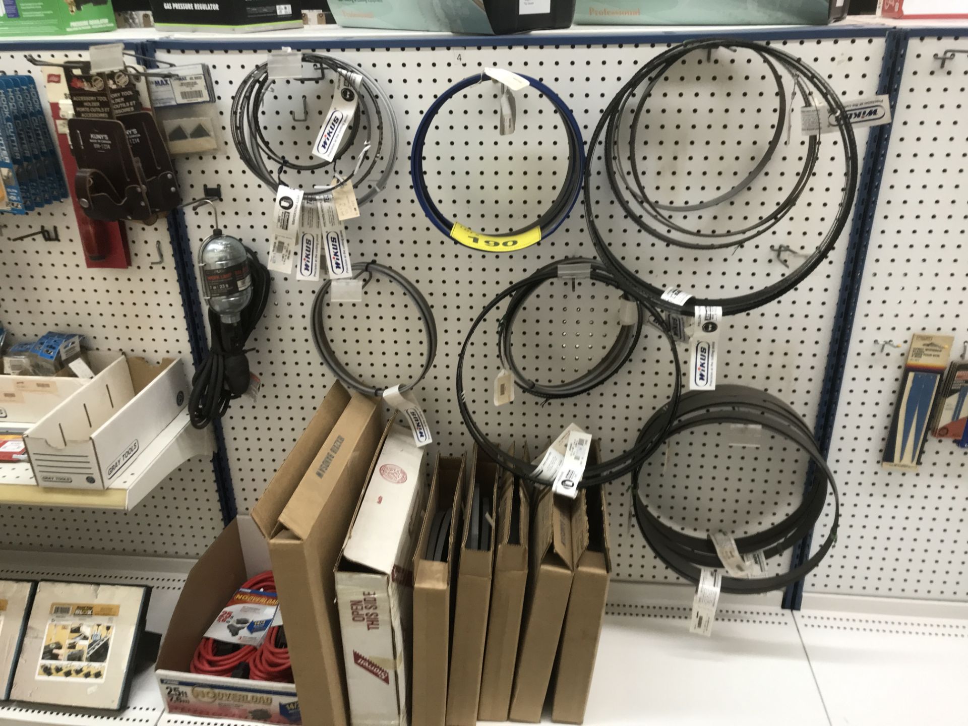 CONTENTS OF (1) SECTION PEG BOARD DISPLAY INCLUDING BANDSAW BLADES, EXTENSION CORDS, LAMP, ETC. (