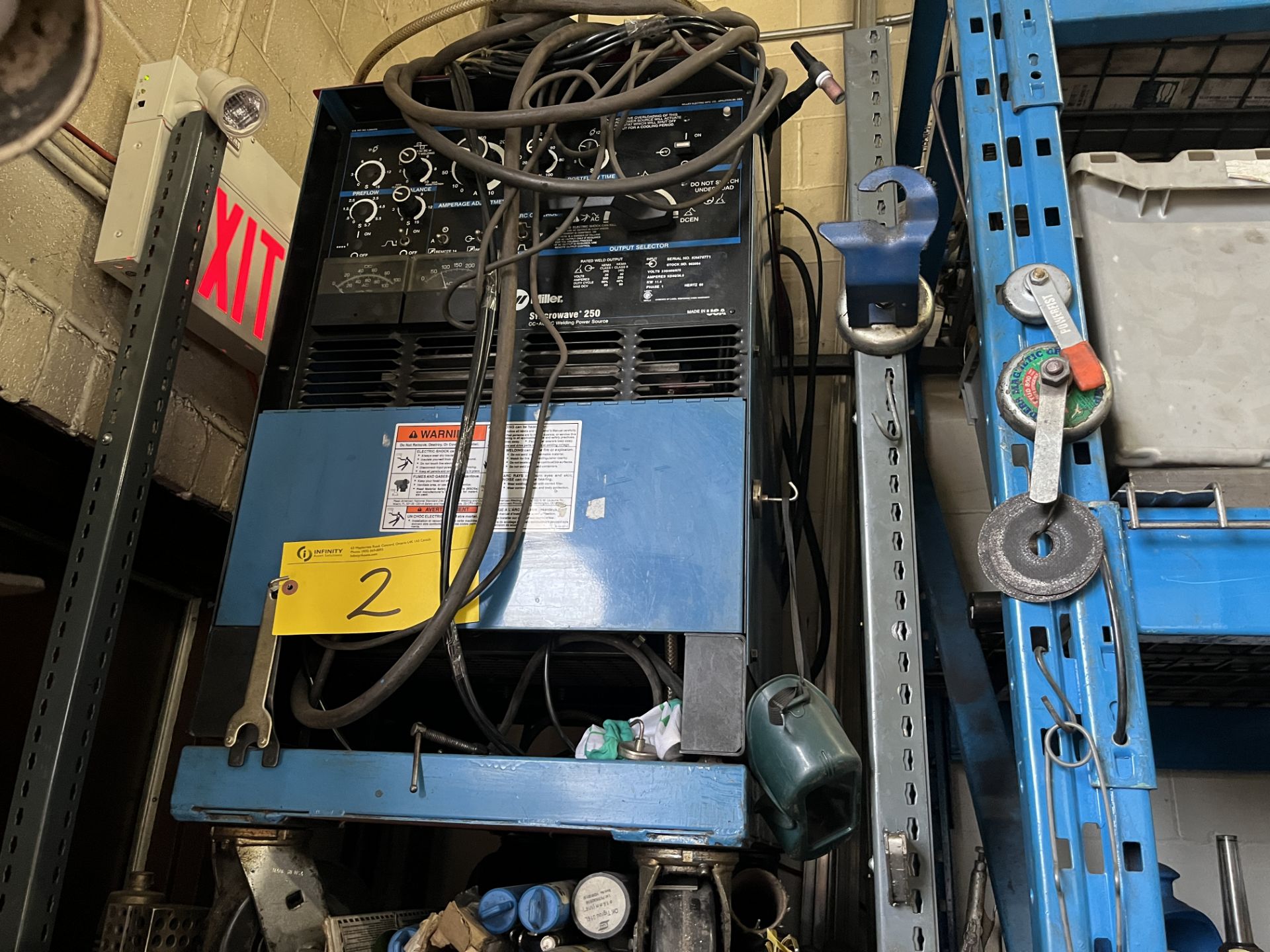 MILLER SYNCROWAVE TIG250 WELDER W/ CABLES AND CASTERS (NO TANKS) (RIGGING FEE $50)