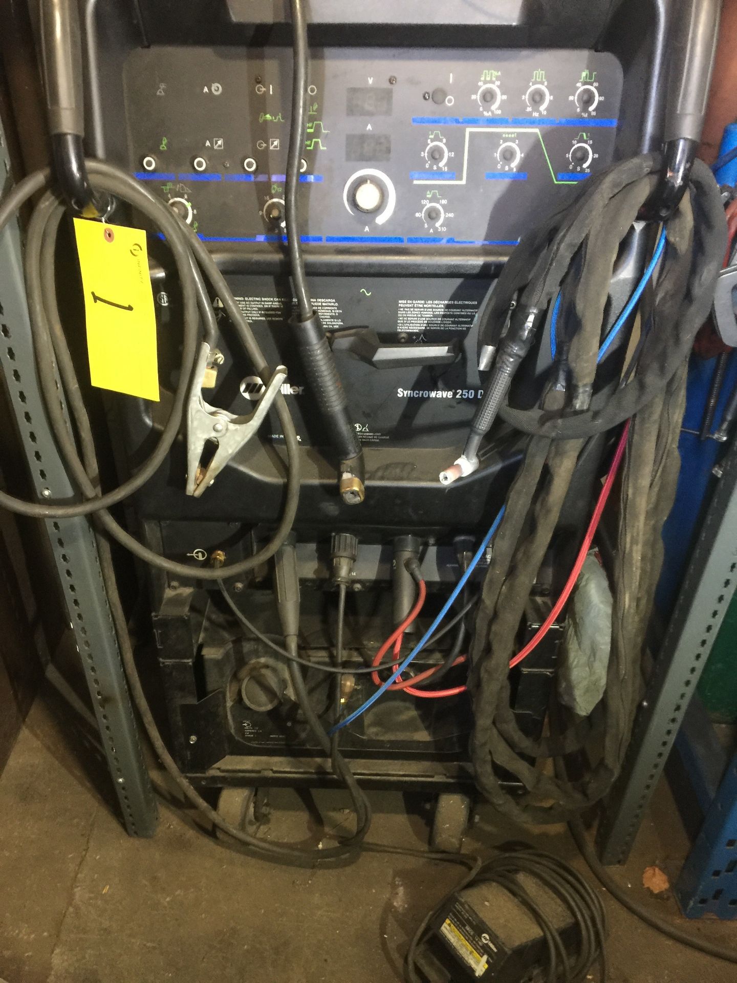 MILLER SYNCROWAVE TIG & STICK 250DX WELDER W/ CABLES AND CASTORS (NO TANKS) (RIGGING FEE $50)