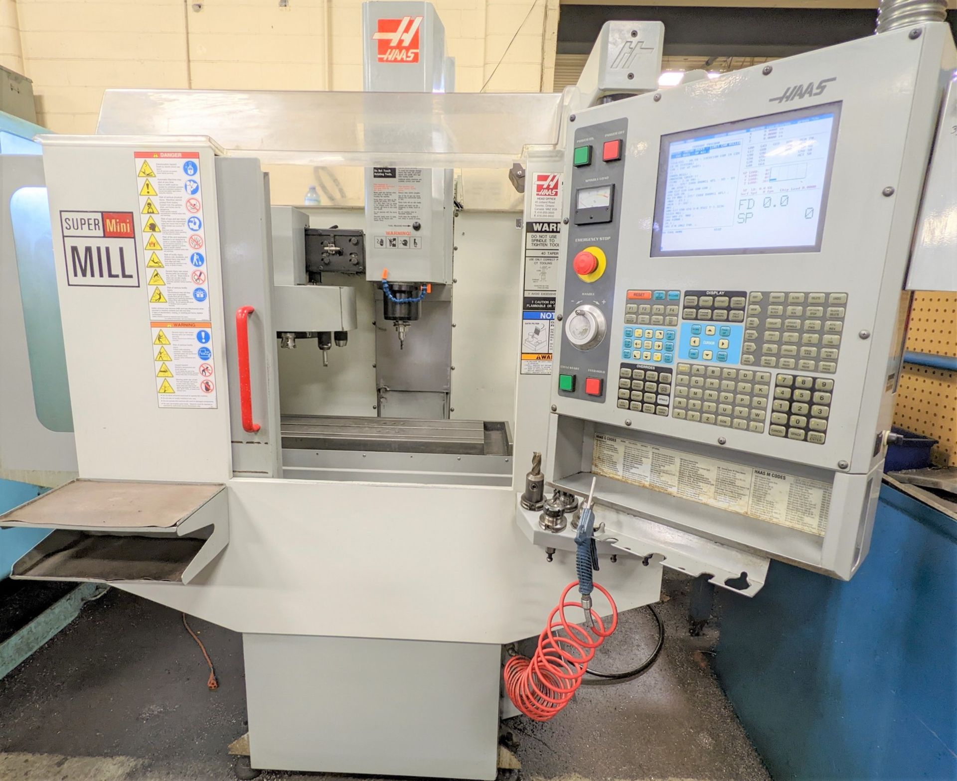 2004 HAAS SUPER MINIMILL CNC VERTICAL MACHINING CENTER, CNC CONTROL, CAT40, 10,000 RPM, 12” X 29”