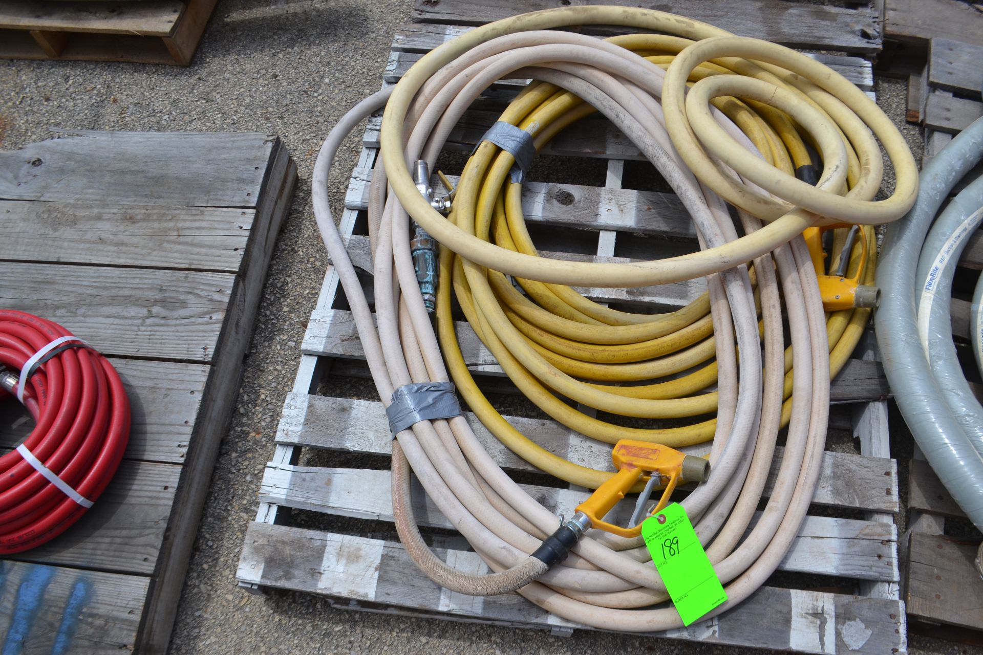 Lot of (2) 1"H Pressure Water Hoses with Spray Nozzles.