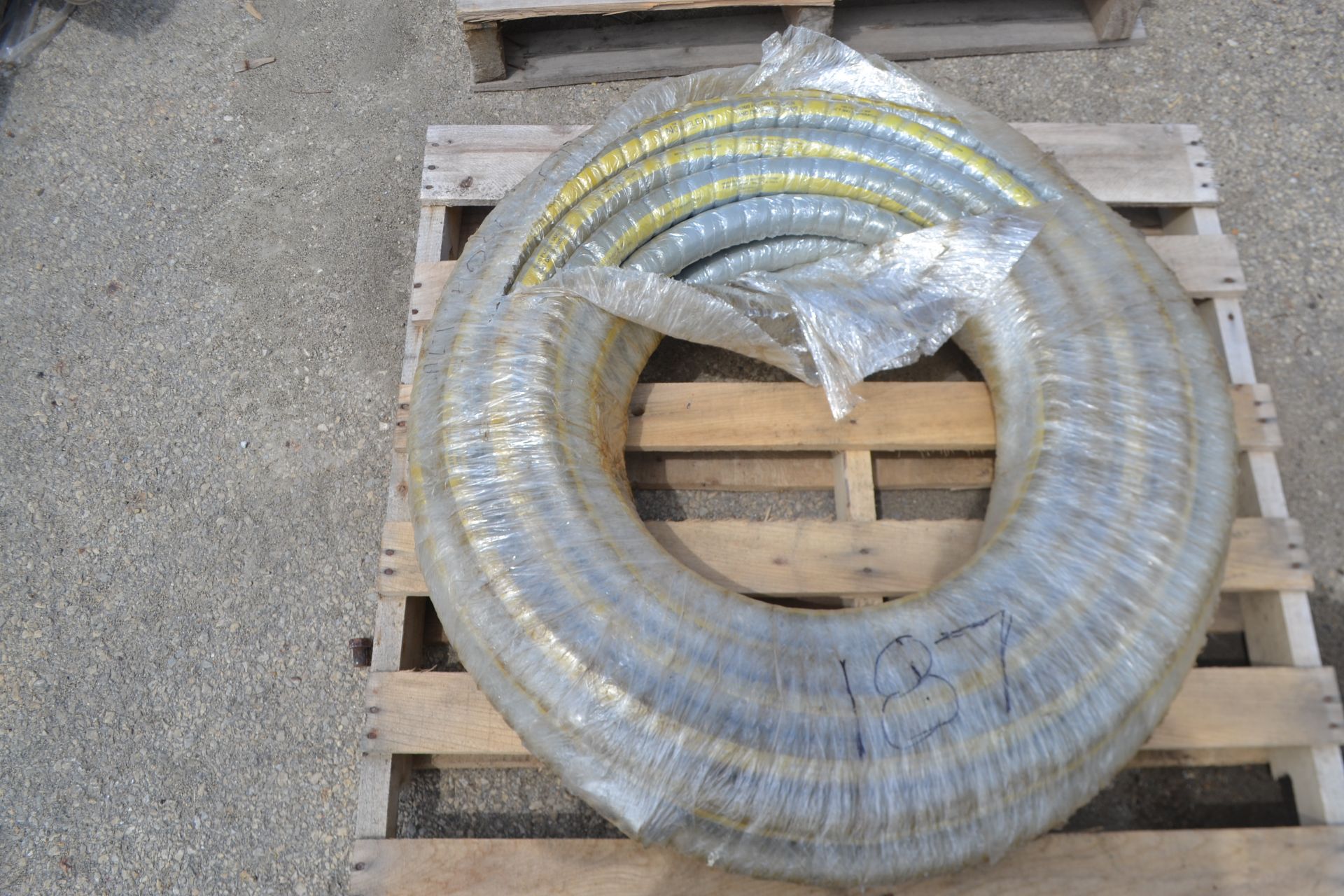 1 Coil of Unused 1.5"Dia Nova Flex 100 PSI Hose.