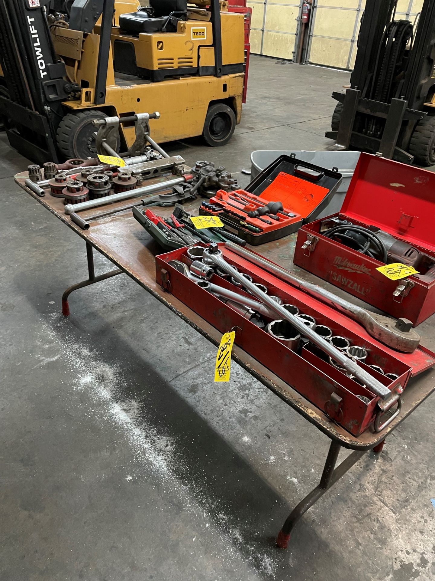 LOT Milwaukee Ratchet Set, Milwaukee Sawzall, Rigid Die Set, Bearing Pullers, Riveters on Table