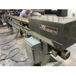 120” Appleton Model A300 automatic core recutter. Operator loads core and sets the target to the
