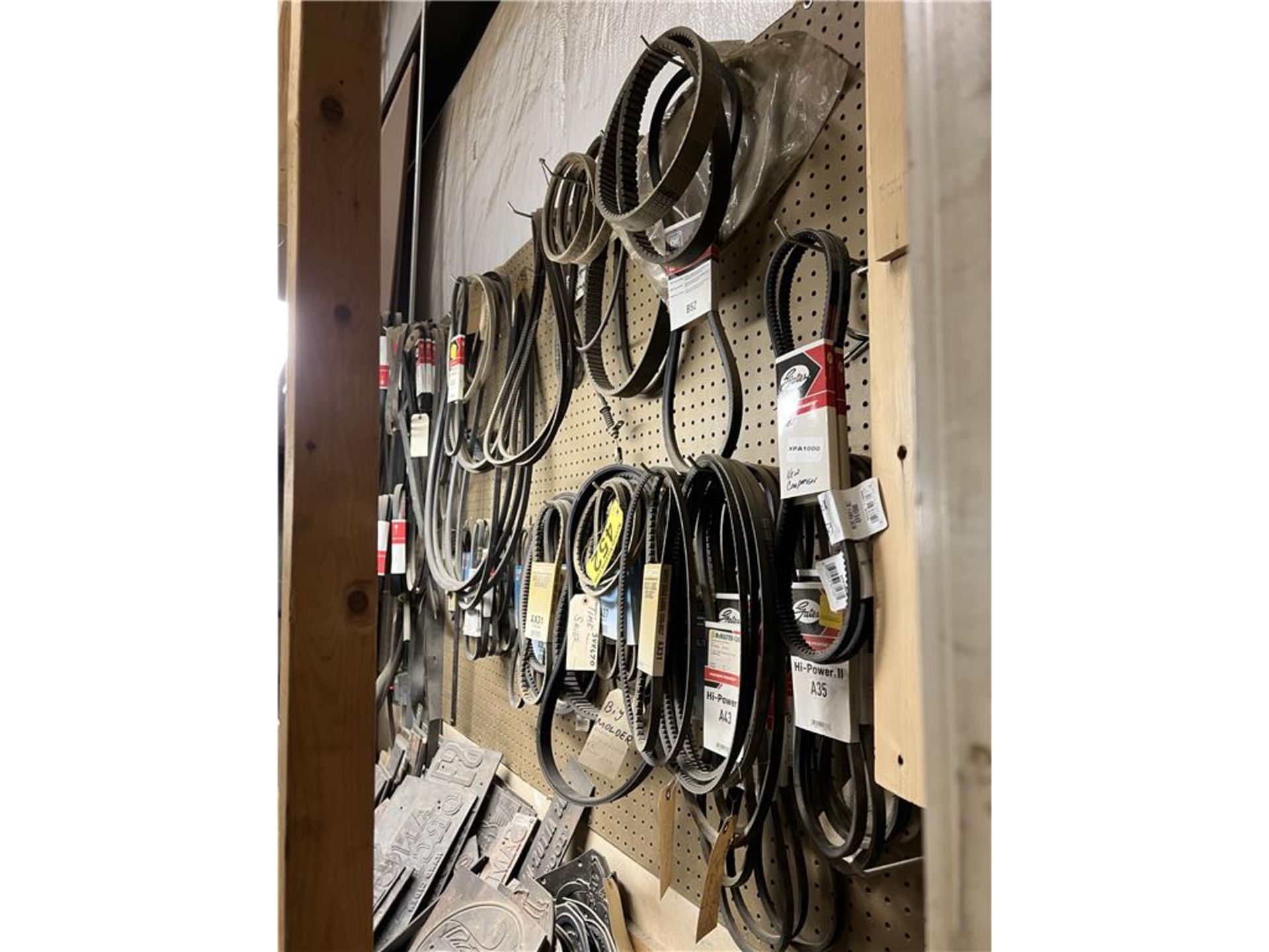BELT INVENTORY ON WALL, APPROX. 90