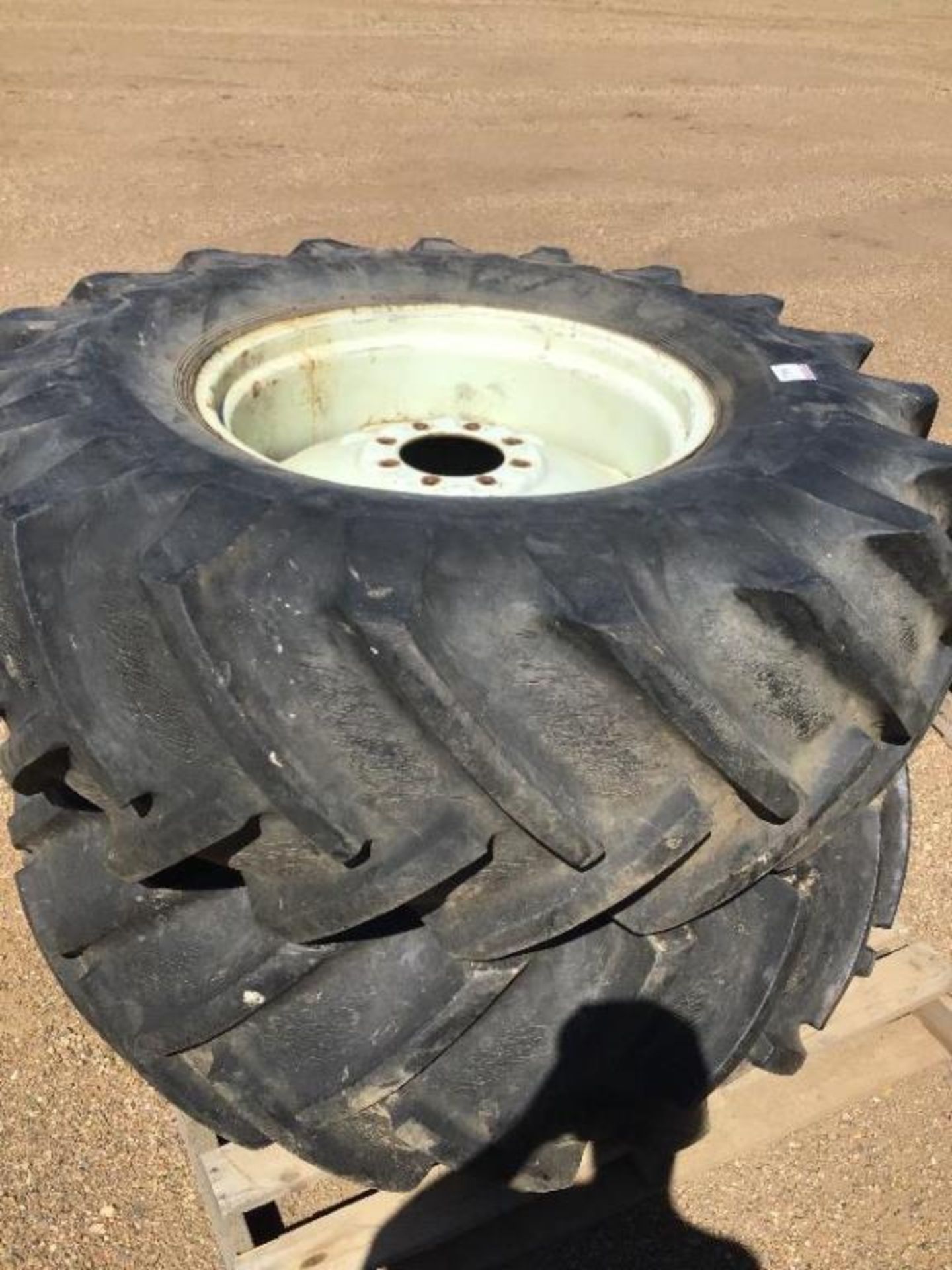 Set of (2) 18.4-26 Tires on 8-Bolt Rims Rims have been measured to fit rear hubs on a Case IH