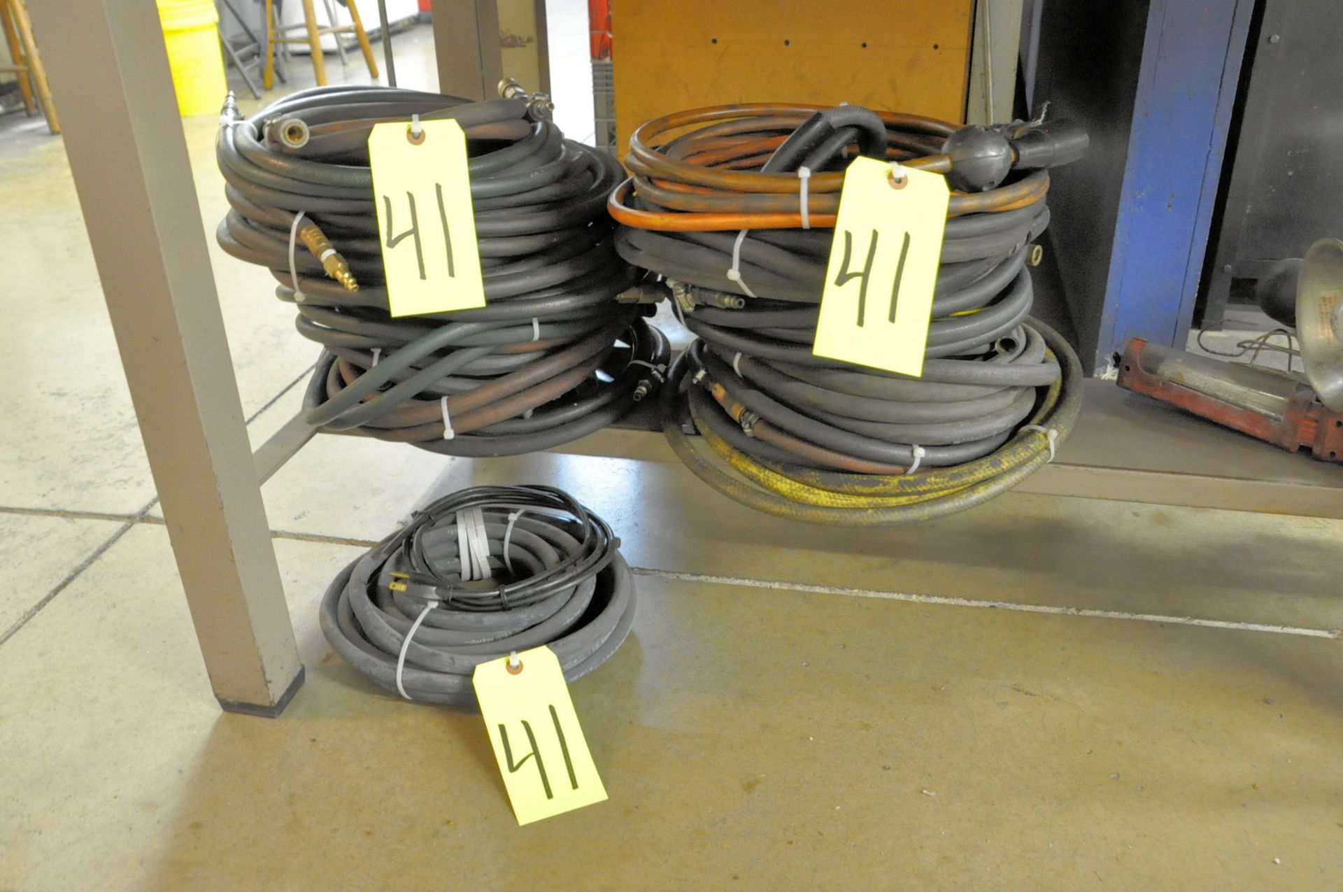 Lot-Various Air Hose in (3) Stacks Under (1) Table