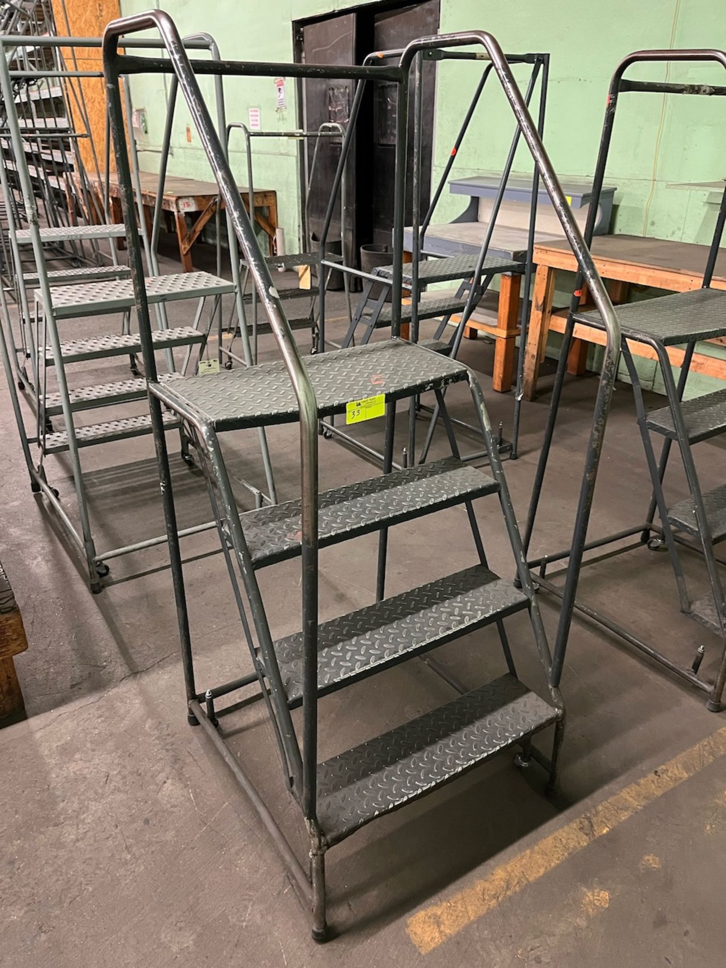 4 step rolling ladder 26" x 31" x 67"