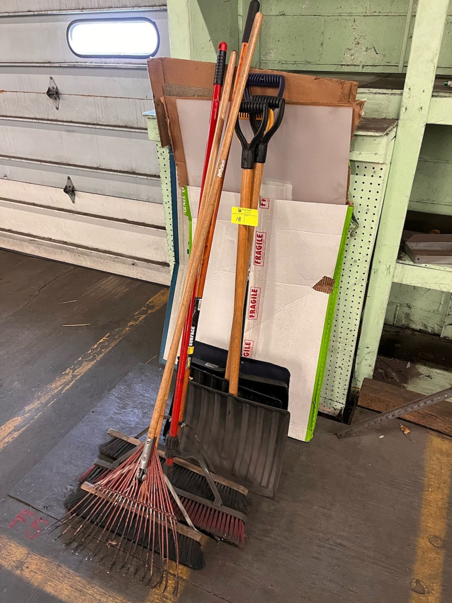 Shovels, brooms and rake