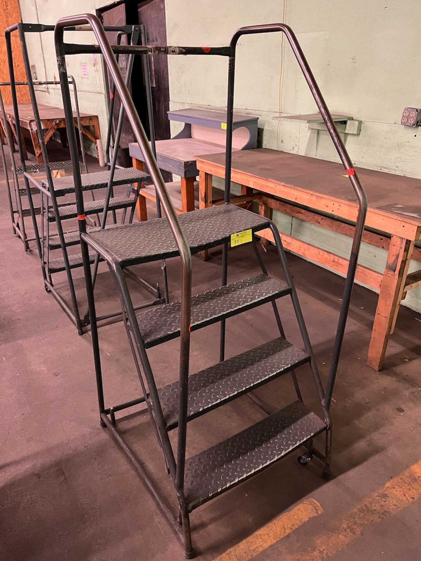 4 step rolling ladder 26" x 31" x 67"