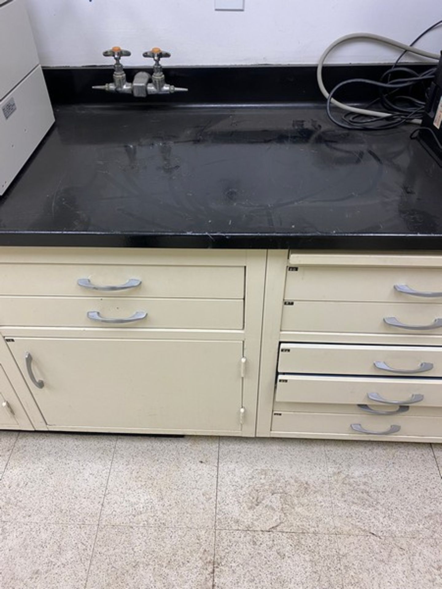 8 Lab cabinets + desk with 21'3" of black lab top / lab table & desk measure 21'3"Lx24"Dx31"H /