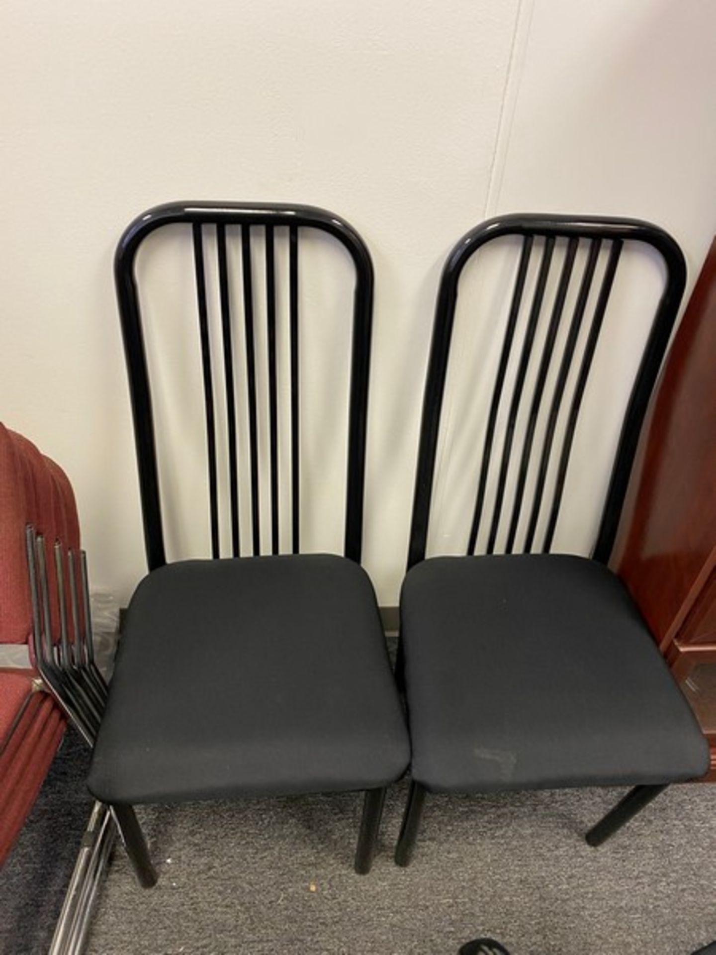 9 Chairs: 4 Black Table chairs and 5 Stackable Chairs (Elevator Handling Fee $20) (Located New - Image 2 of 6