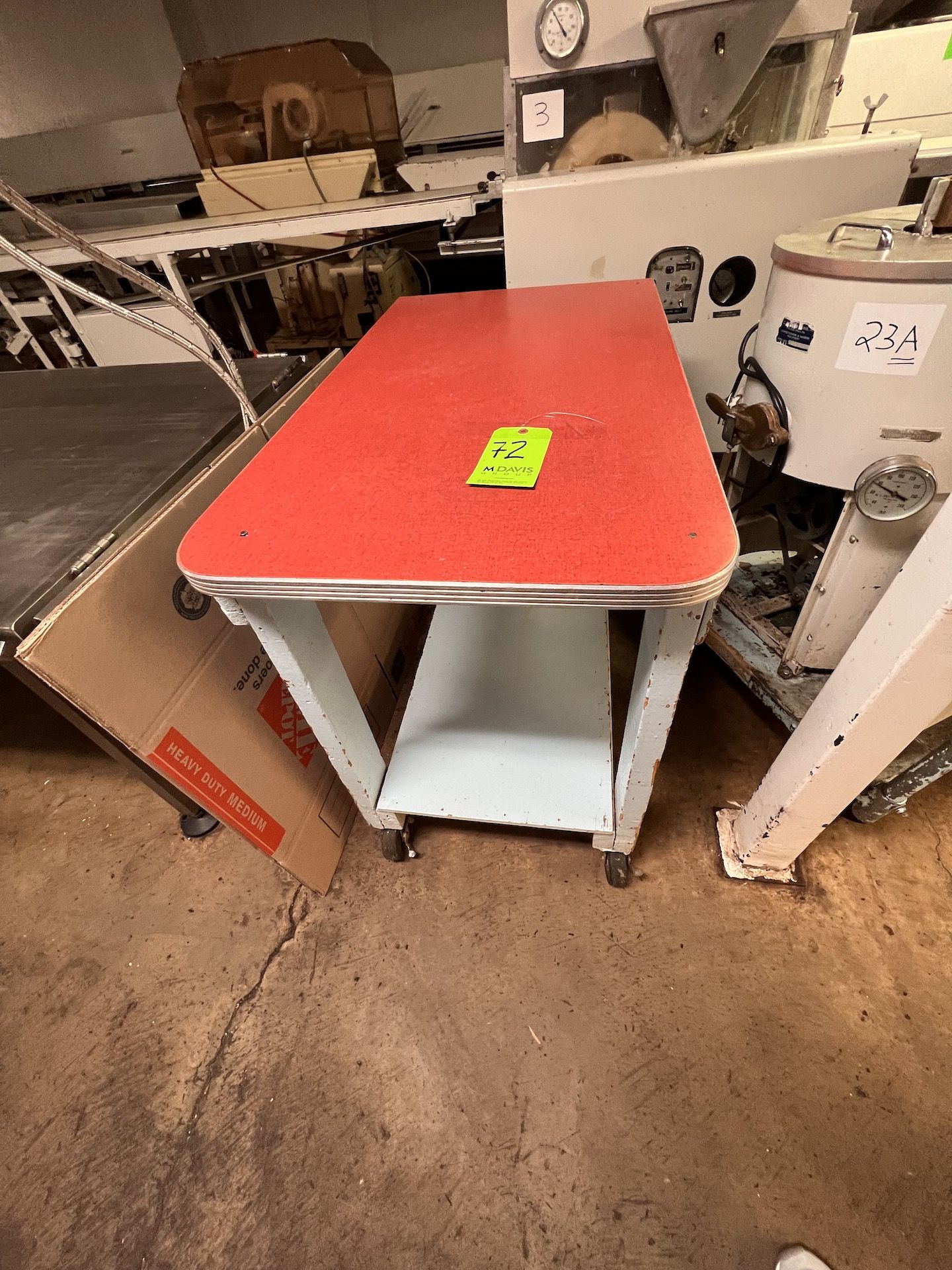 TABLE MOUNTED ON CASTERS42"" L X 24"" W X 34"" H