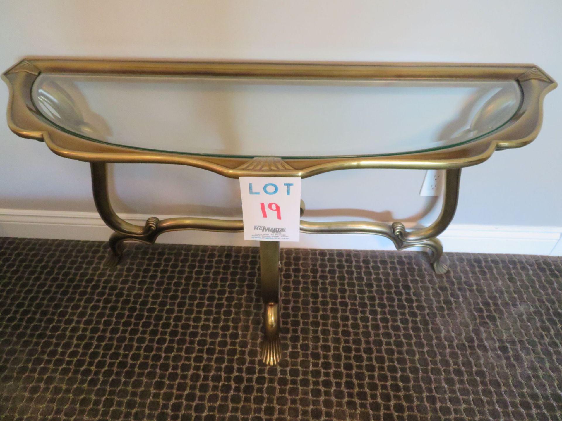 Decorative brass table with glass approx. 52"w x 19"d x 28"h