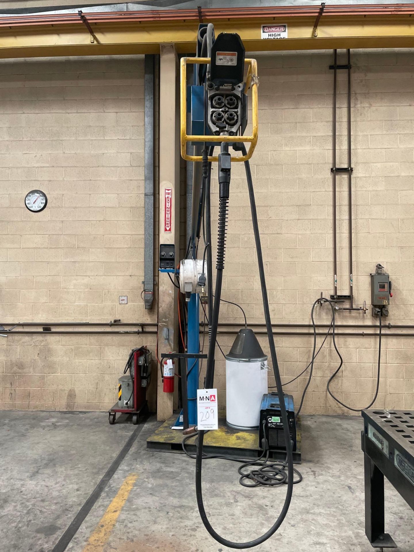 Miller XMT 450 Welder with boom feeder cell