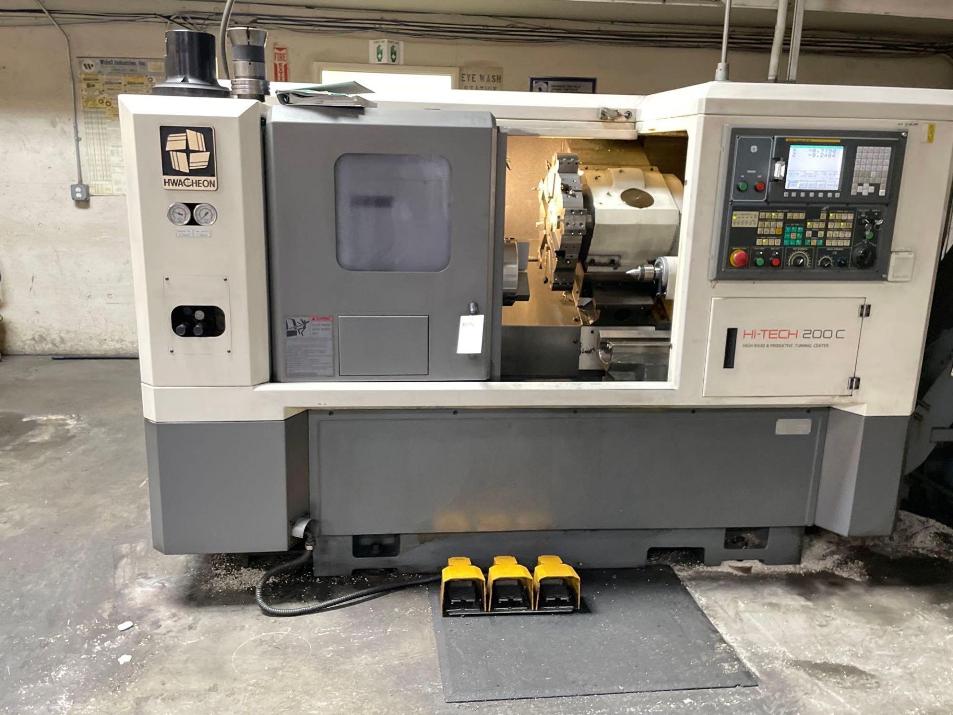 Hwacheon HiTech 200C CNC Turning Center, Fanuc 0i-TC control, 10” chuck, 3” bar cap., New 2006