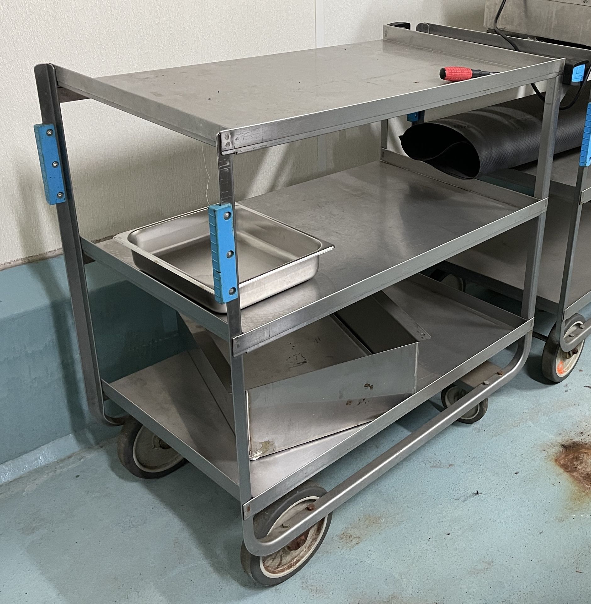Stainless Steel three shelf Rolling cart.